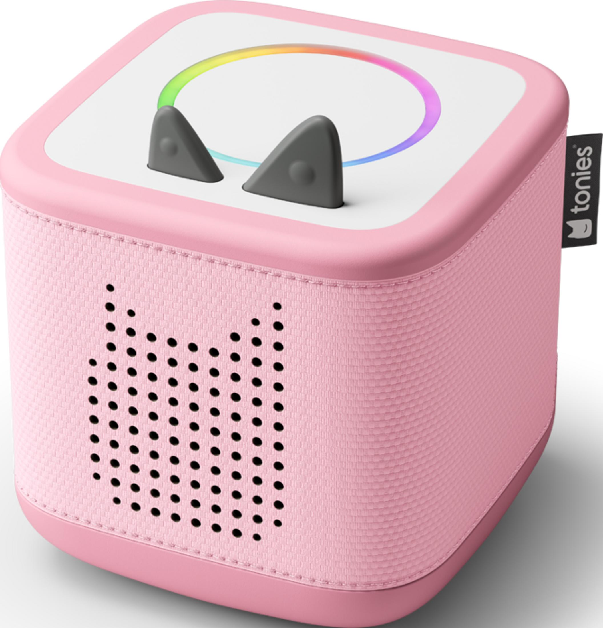 Une enceinte Toniebox rose avec oreilles et lumière arc-en-ciel.