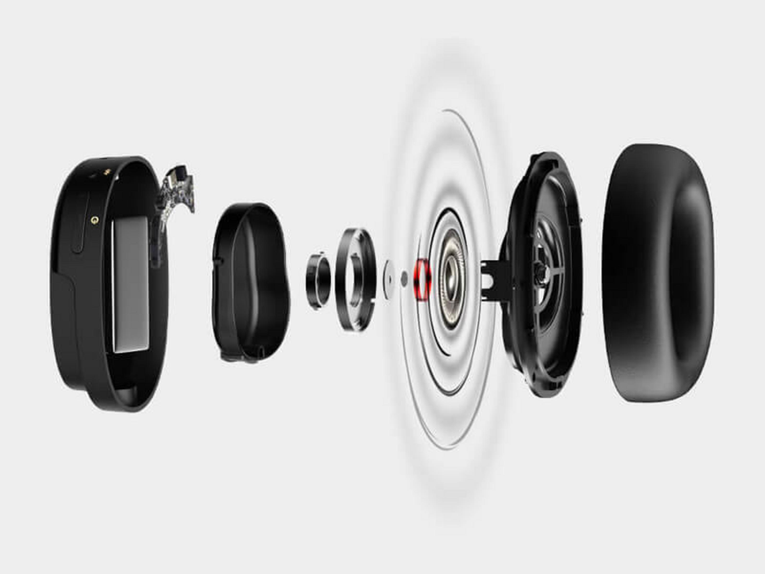 Widok rozstrzelony czarnych słuchawek pokazujący wewnętrzne komponenty.