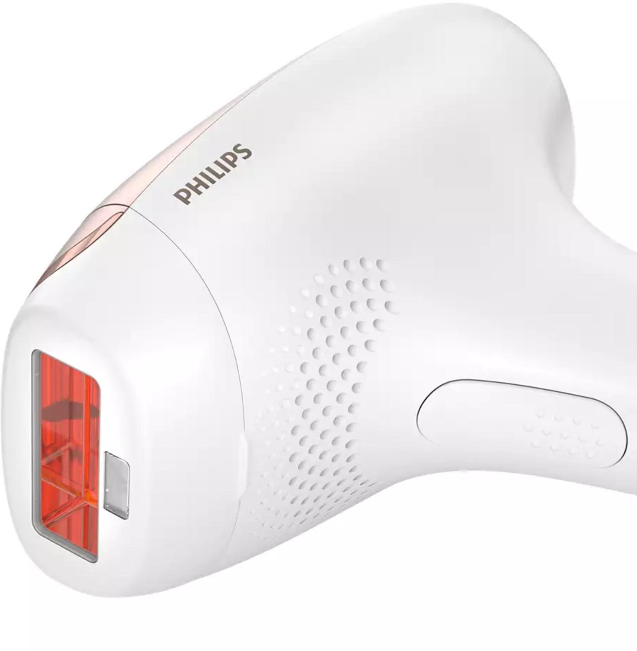 Un dispositivo blanco Philips para depilación con lentes rojas y rejillas de ventilación.