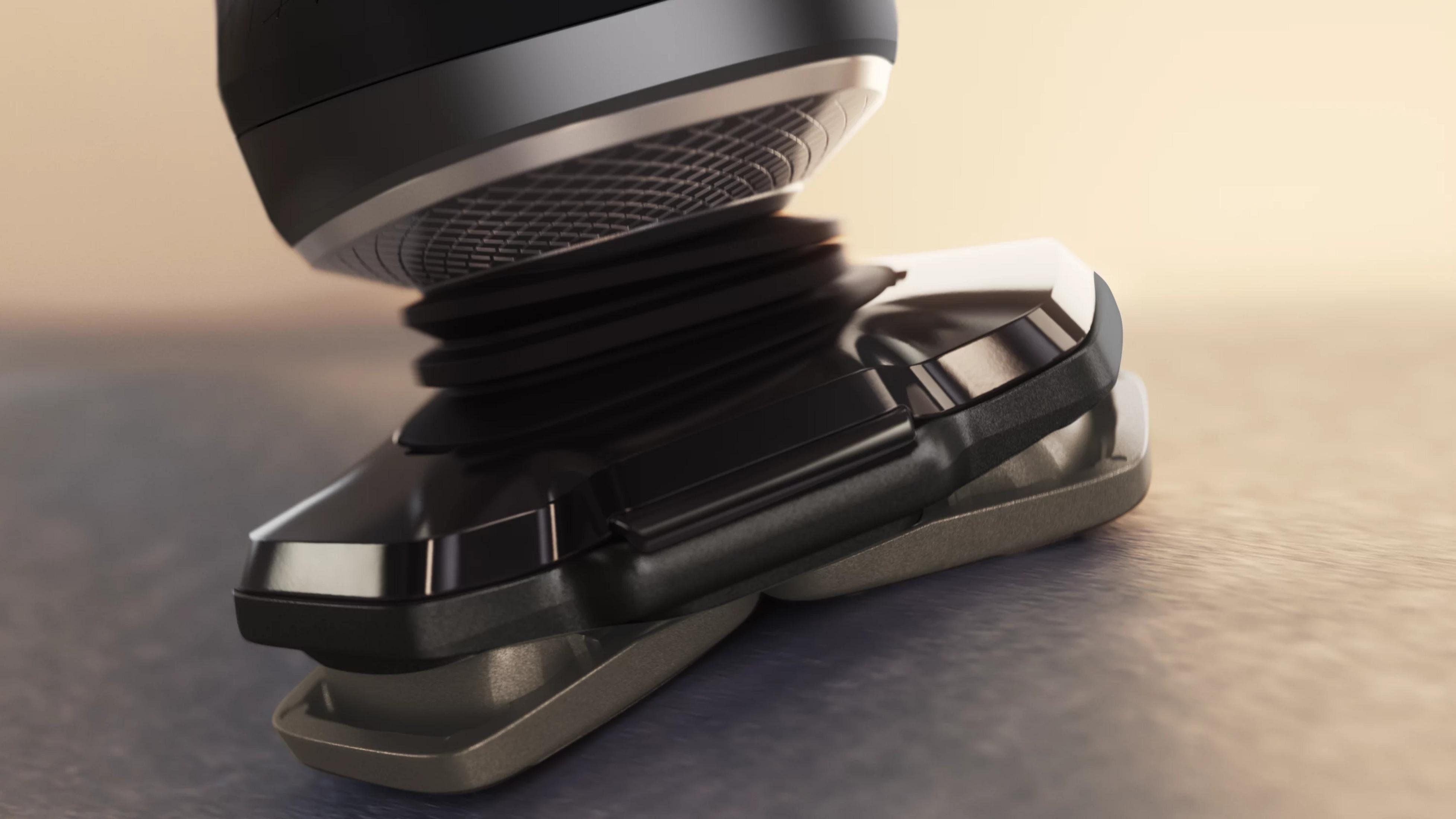 Zbliżenie czarnej golarki elektrycznej ze srebrnymi akcentami na teksturowanej powierzchni.