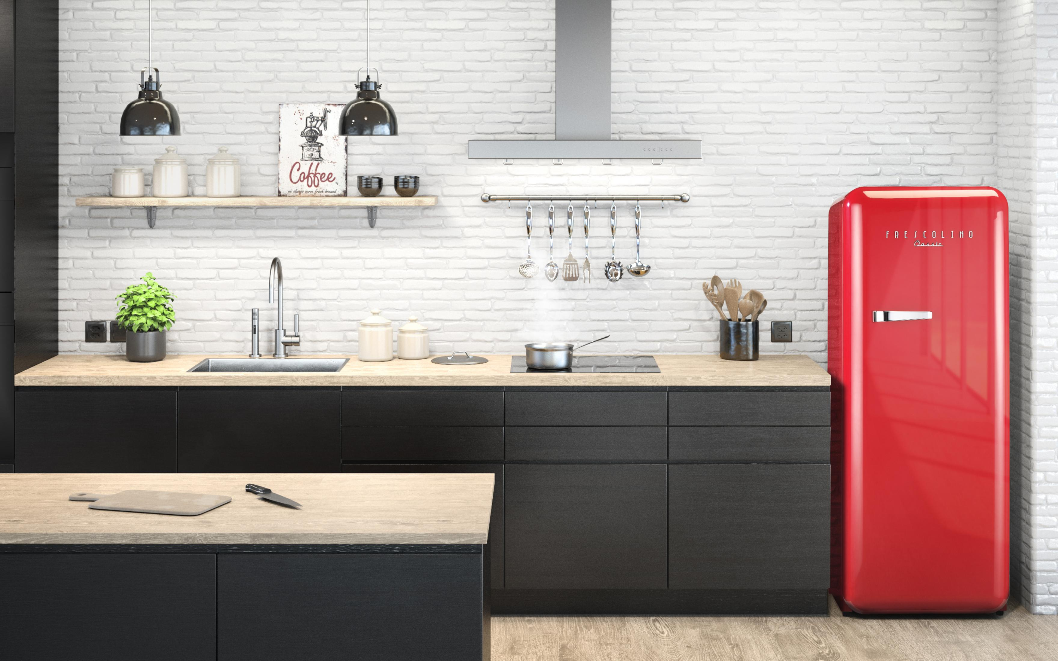 Cuisine moderne avec réfrigérateur rouge, évier, cuisinière et plan de travail en bois.