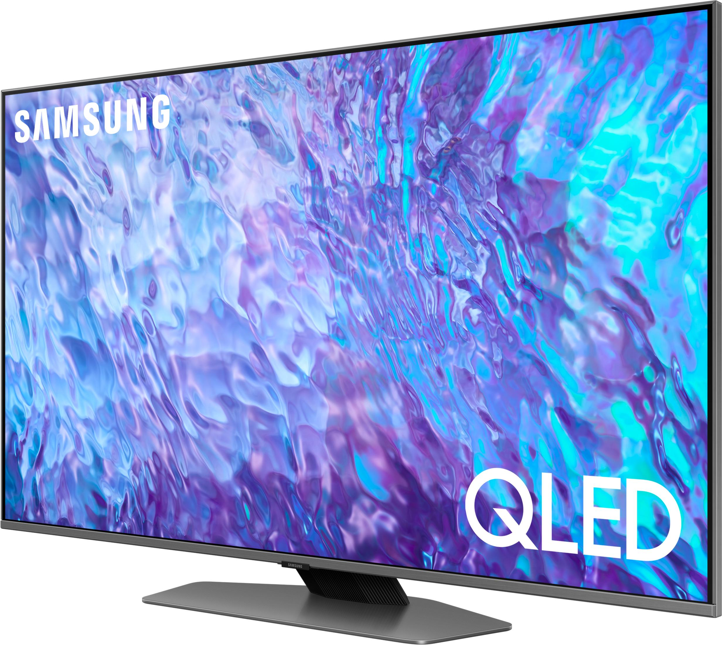Telewizor Samsung QLED wyświetlający abstrakcyjny wzór w kolorach niebieskim i fioletowym.