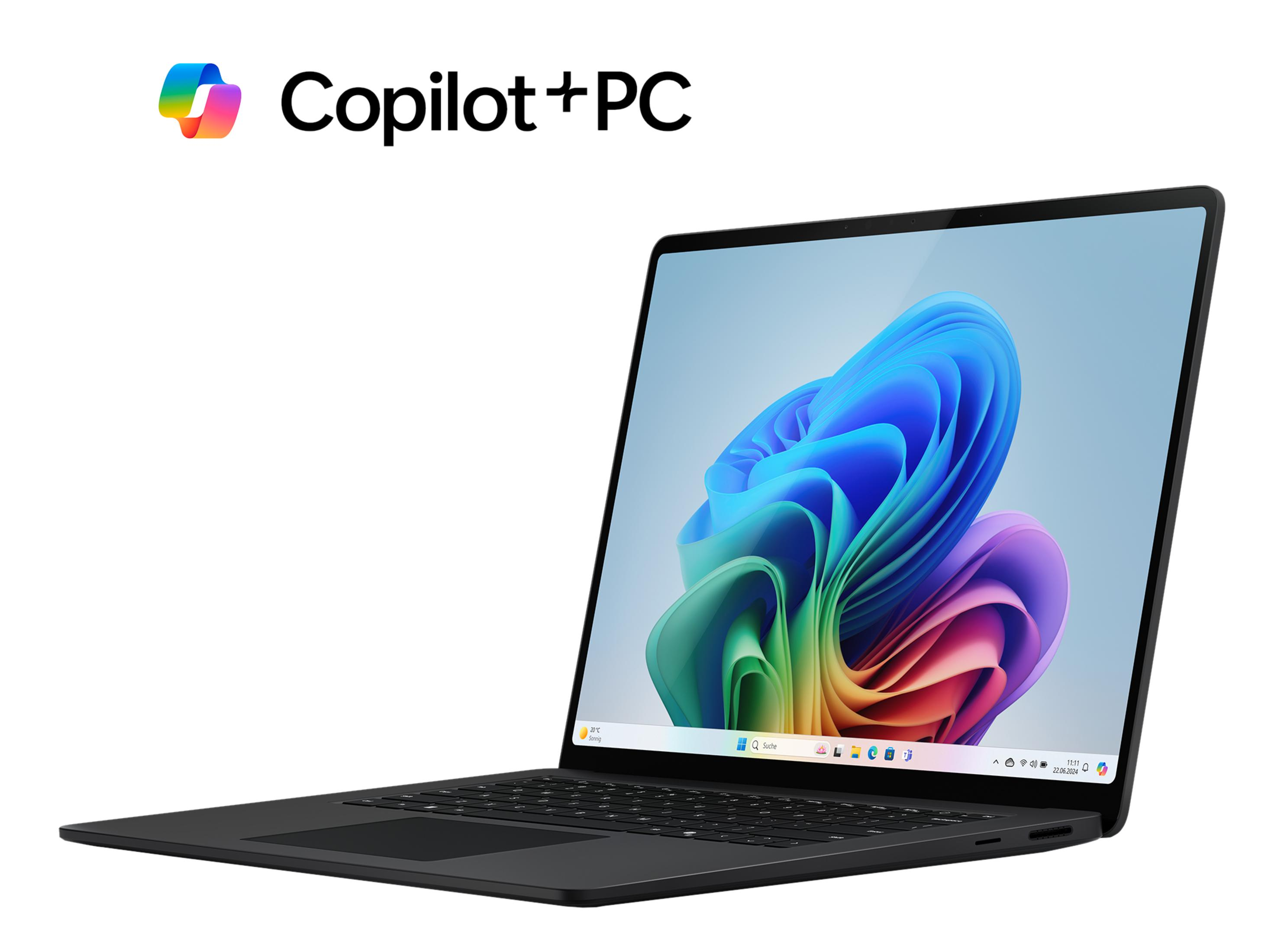 Un laptop nero con logo Copilot+ PC e sfondo colorato.