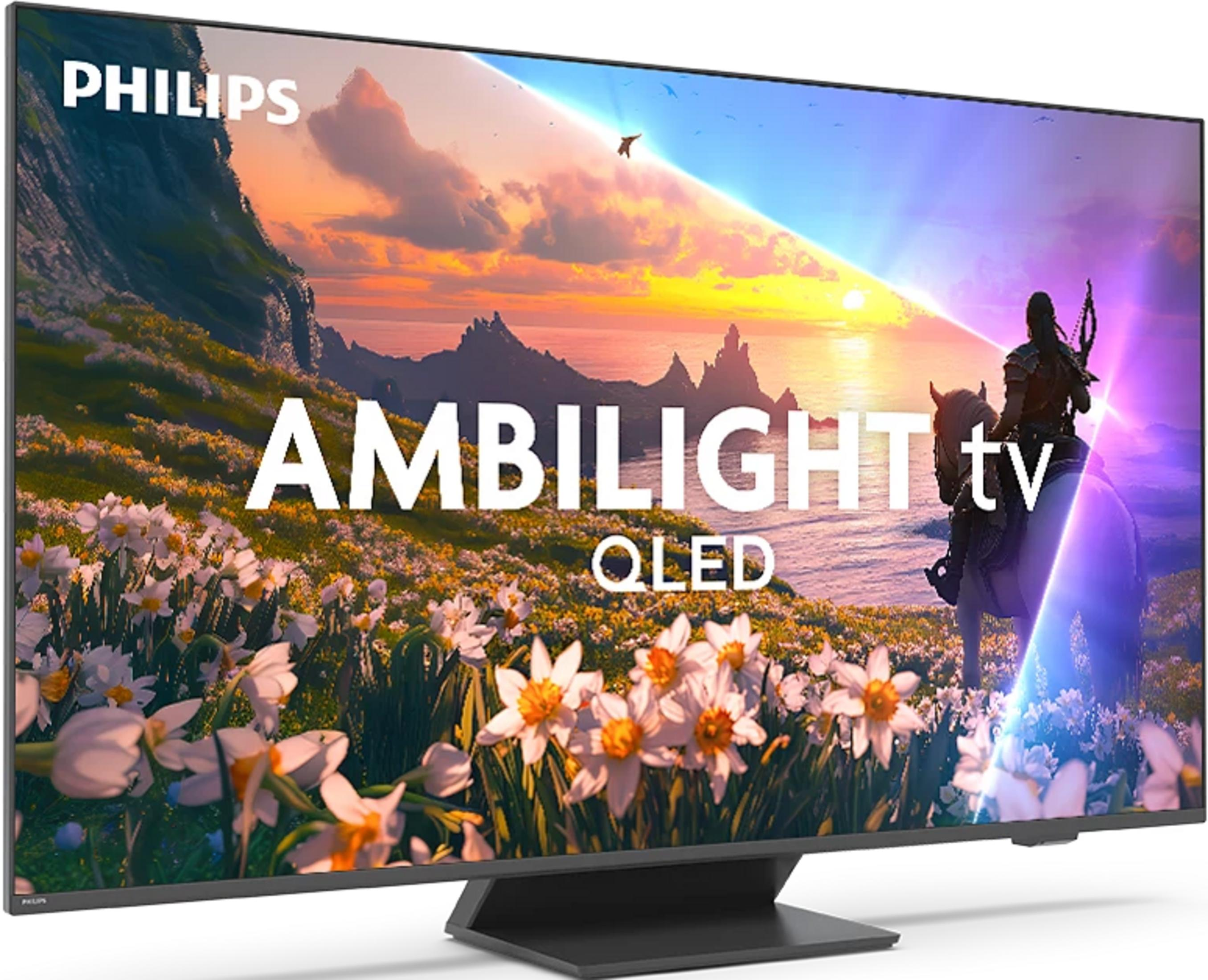 Telewizor Philips Ambilight QLED z krajobrazem górskim, kwiatami i jeźdźcem na koniu.