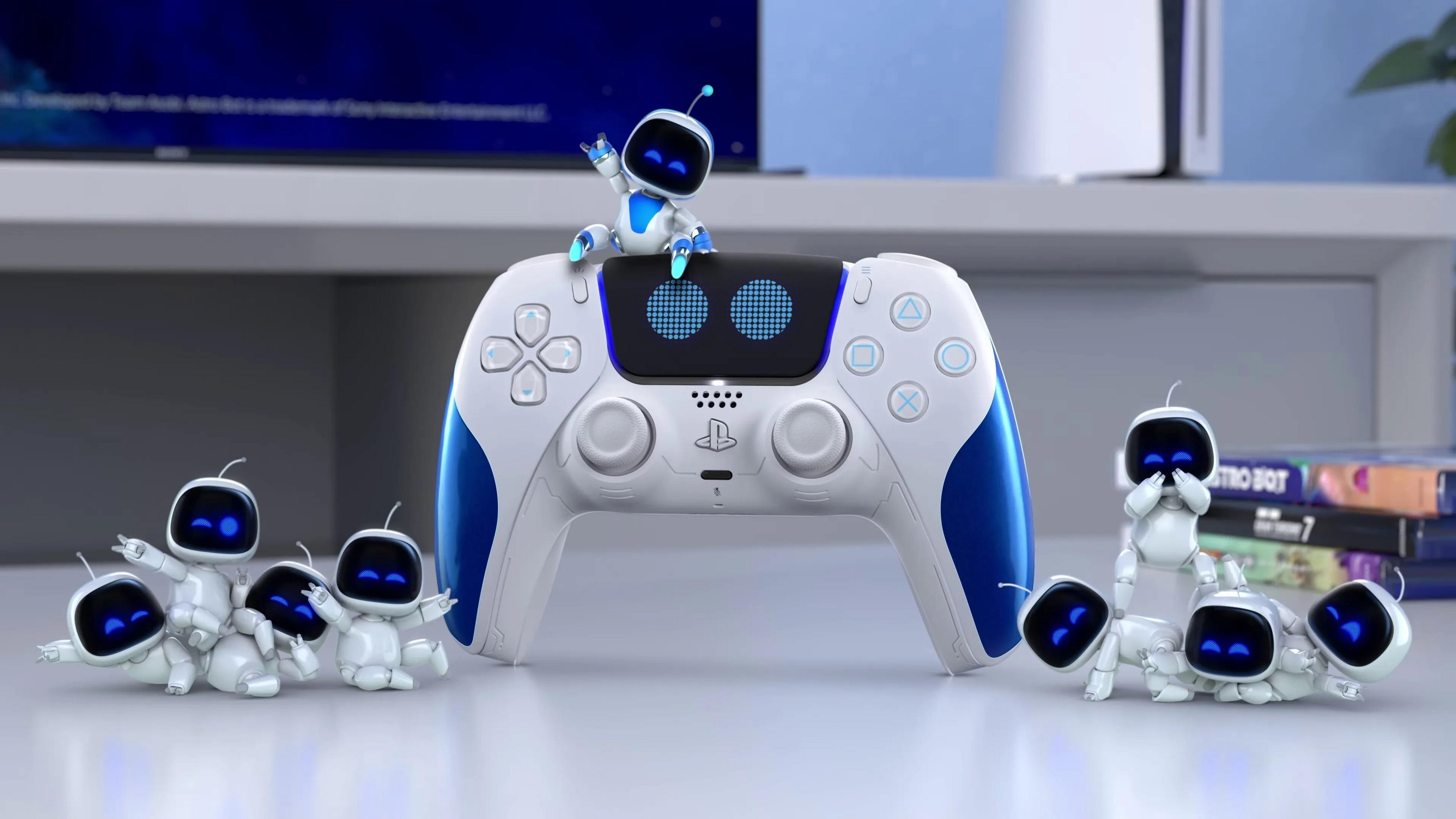 Astro Bot sitzt auf einer weißen und blauen Controller, andere Bots liegen herum.