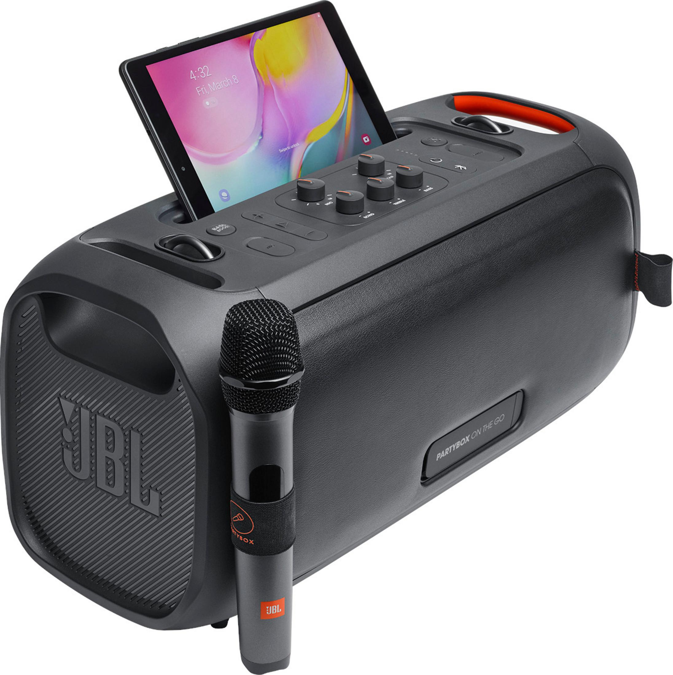 Un altavoz JBL Partybox negro con micrófono y tableta.