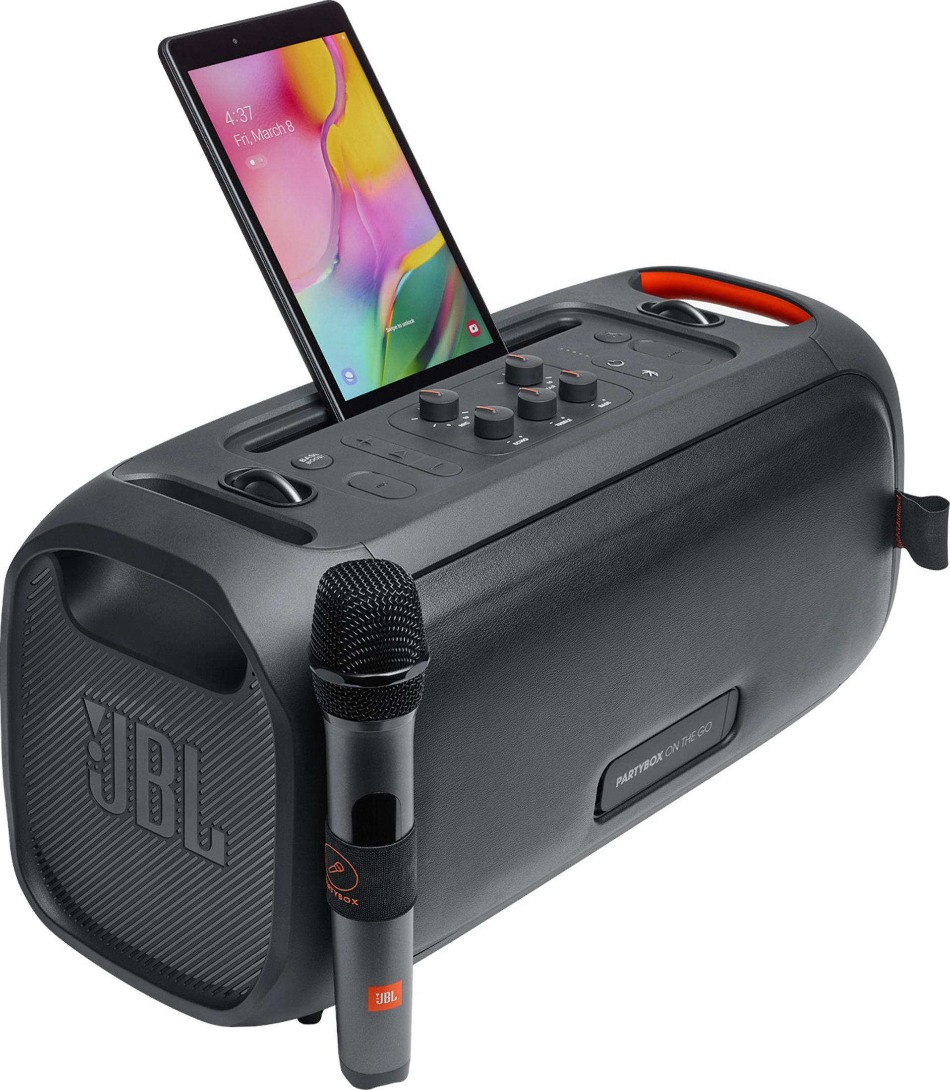 Un altavoz JBL Partybox negro con micrófono y tablet.