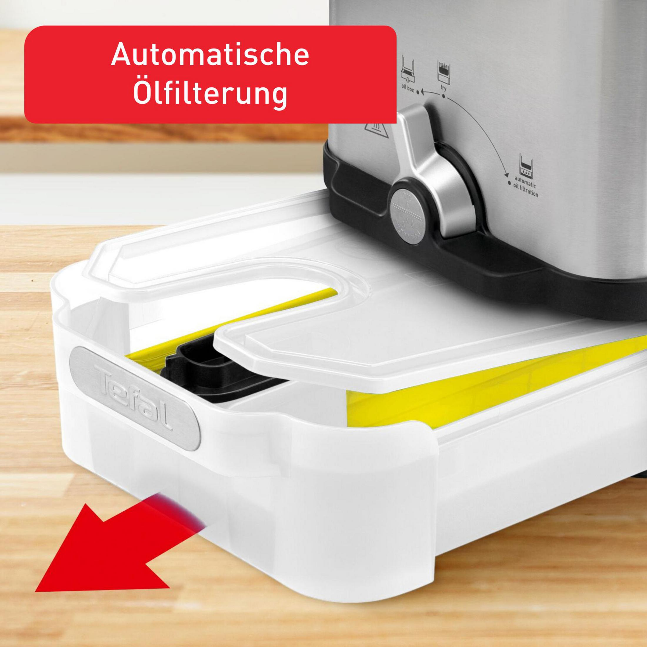 Frytkownica ze stali nierdzewnej z białym pojemnikiem na olej i czerwoną strzałką.