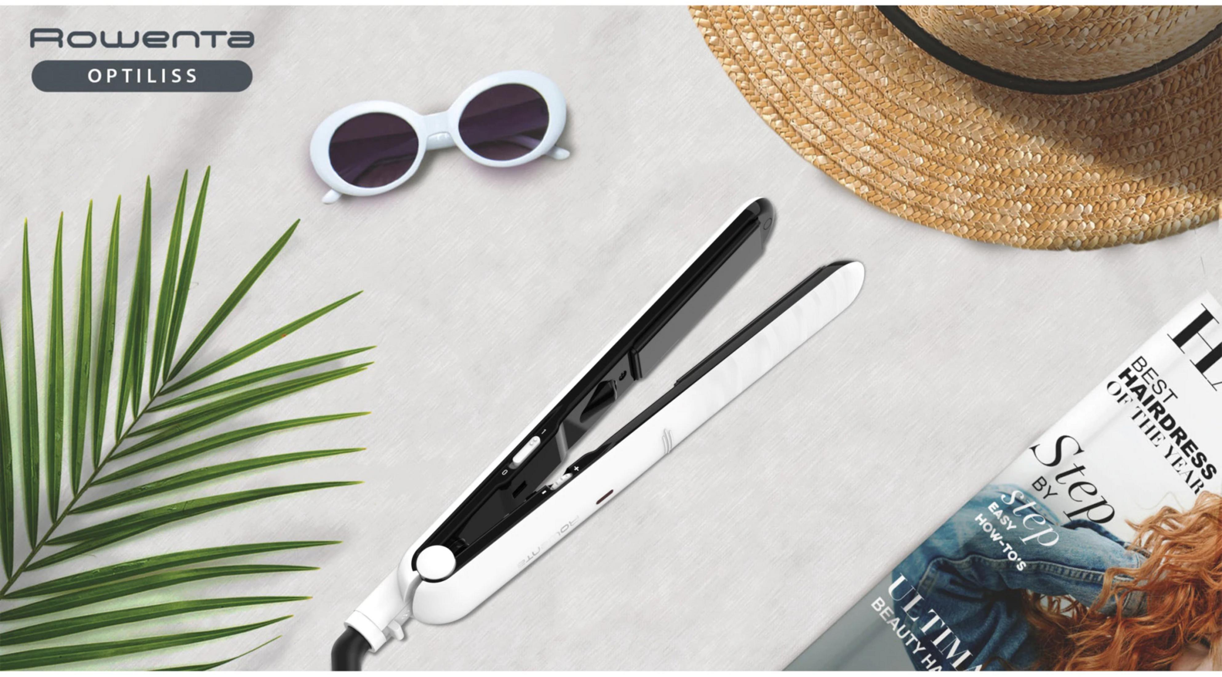 Una plancha de pelo blanca Rowenta yace cerca de gafas de sol, un sombrero y una revista.