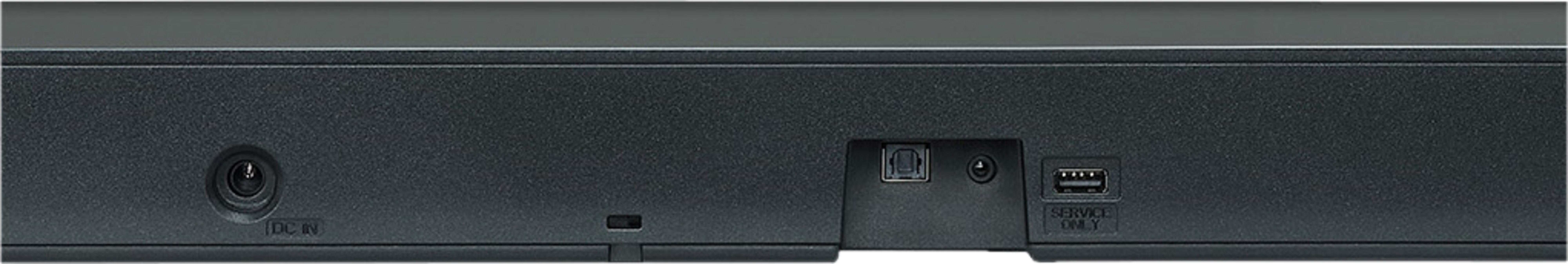 Rückseite eines schwarzen Geräts mit Anschlüssen: DC IN, USB, TOSLINK.