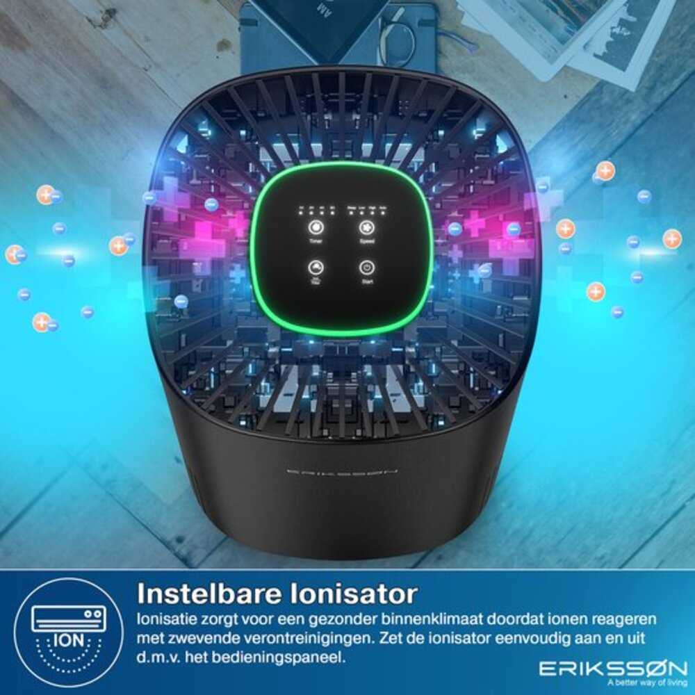 A black air purifier with green light and ions in operation.