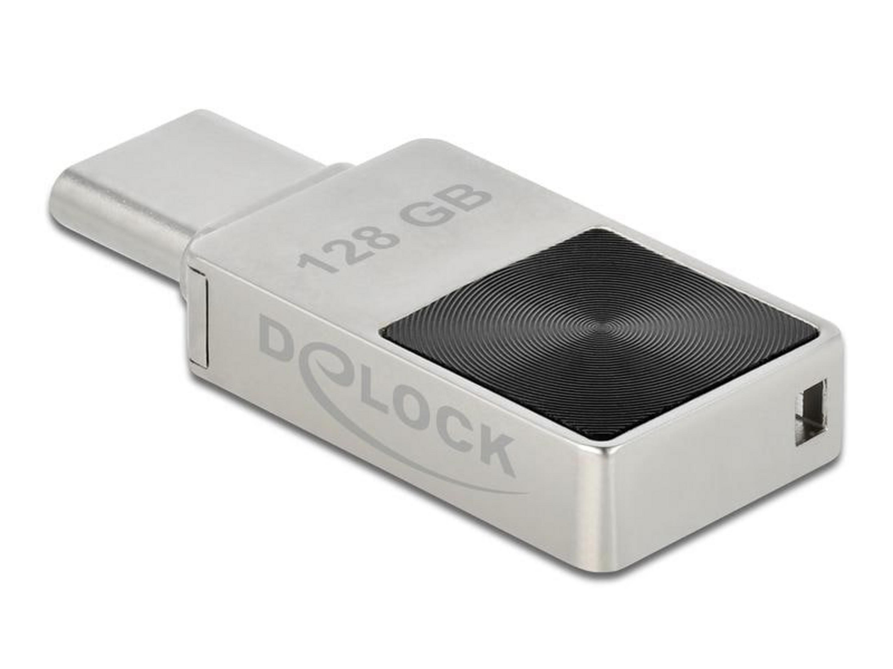 Srebrny pendrive USB-C 128 GB z czarnym, okrągłym wzorem.