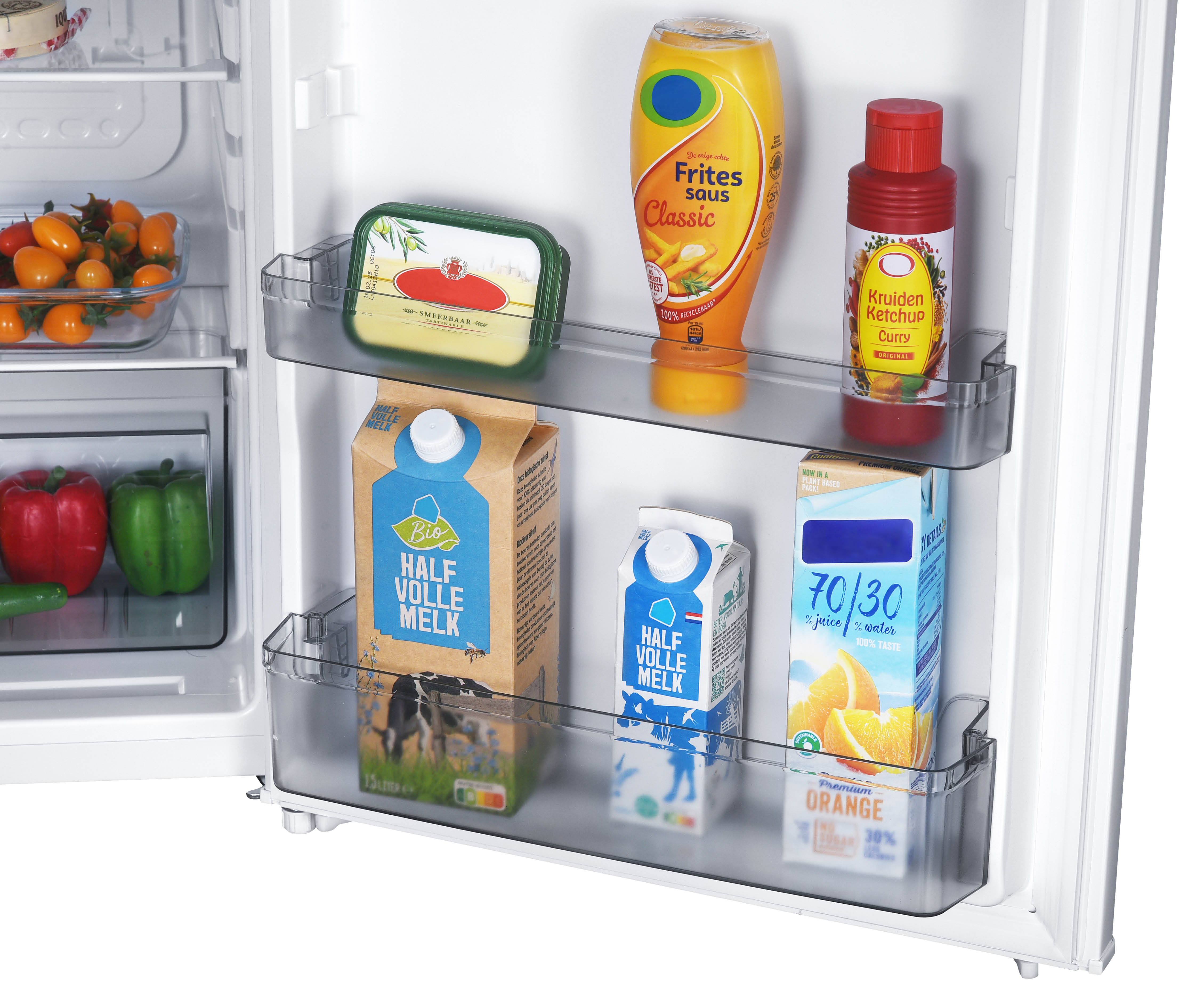 A refrigerator interior with various food items: tomatoes, peppers, milk, sauces, ketchup.