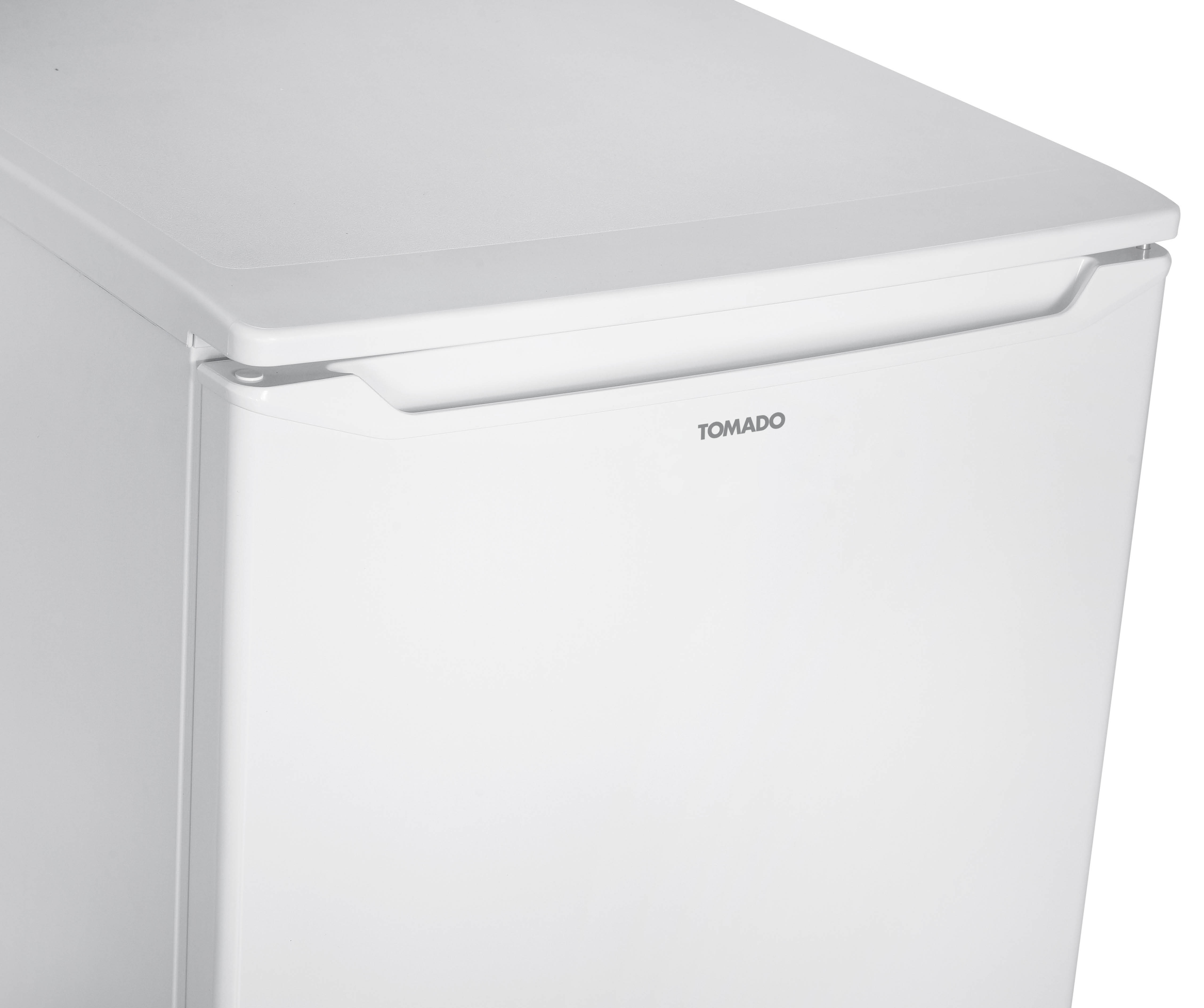A white refrigerator door with the brand name TOMADO in gray lettering.