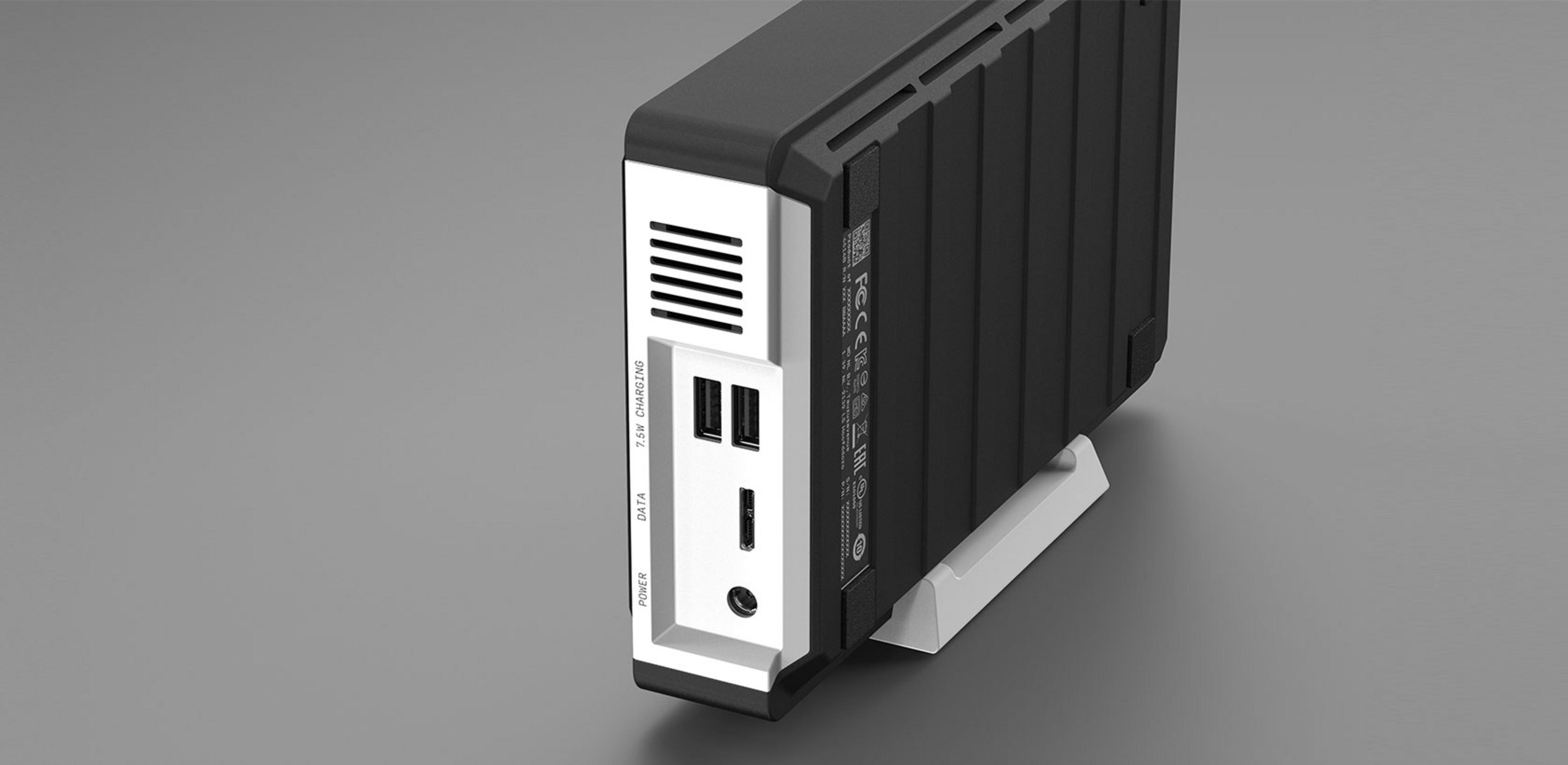 Czarny dysk zewnętrzny z portami USB i otworami wentylacyjnymi, na stojaku.