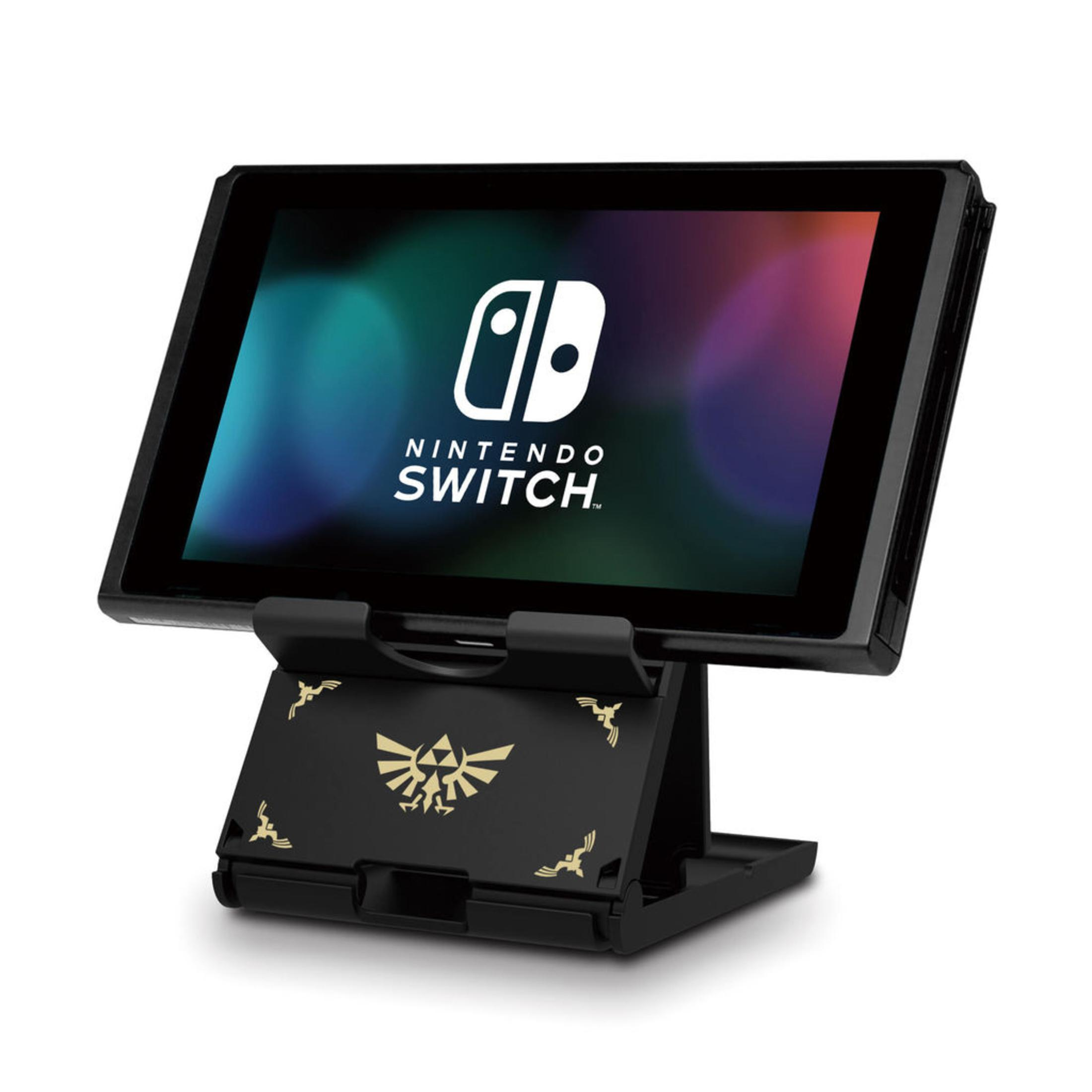 Nintendo Switch auf einem schwarzen Ständer mit Zelda-Symbolen.