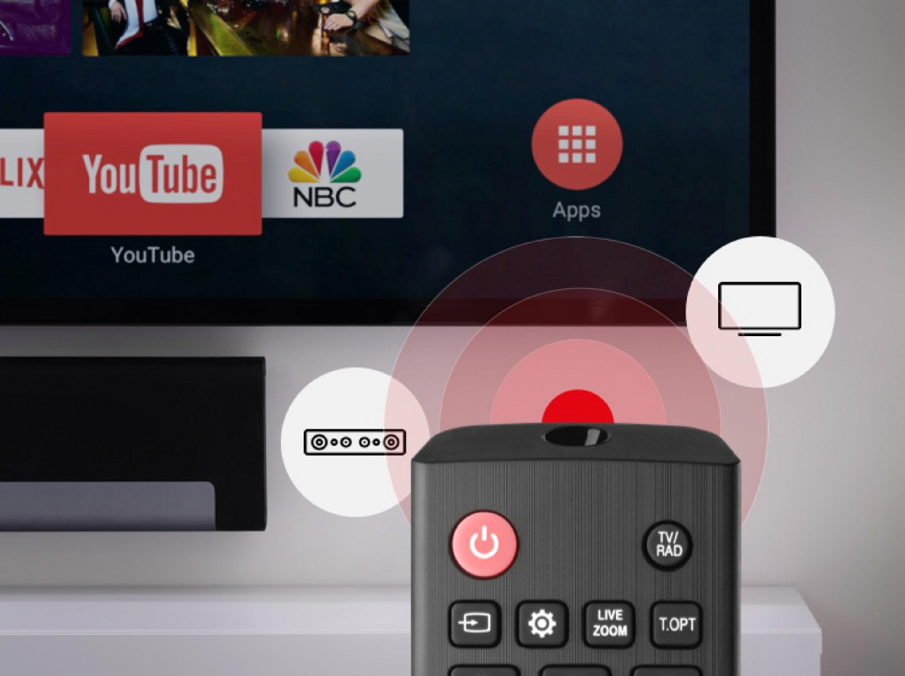 A remote control with power button on a smart TV screen showing app icons.