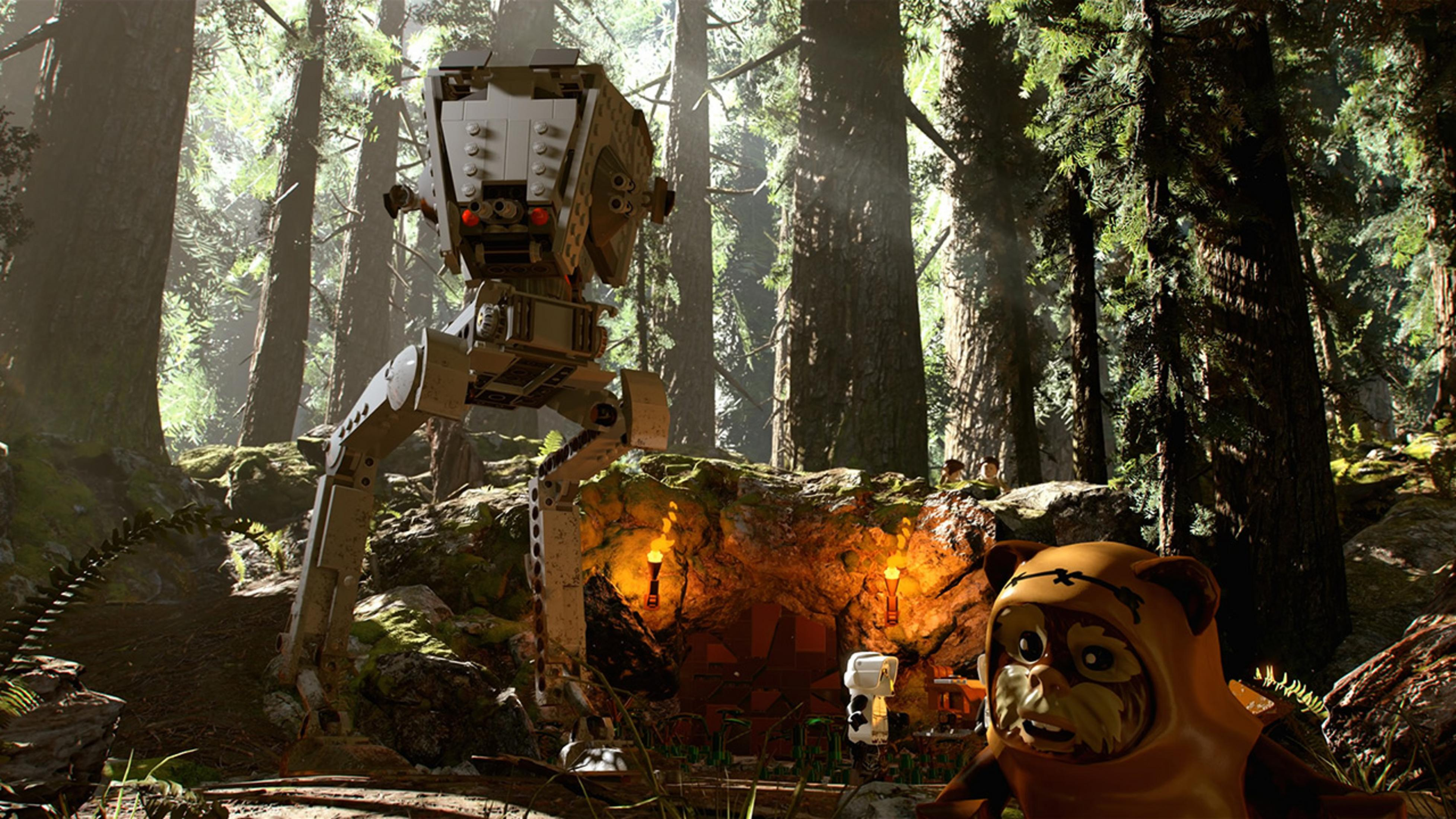 Ein Lego AT-ST Walker steht in einem Wald neben einem Ewok und einer Höhle.