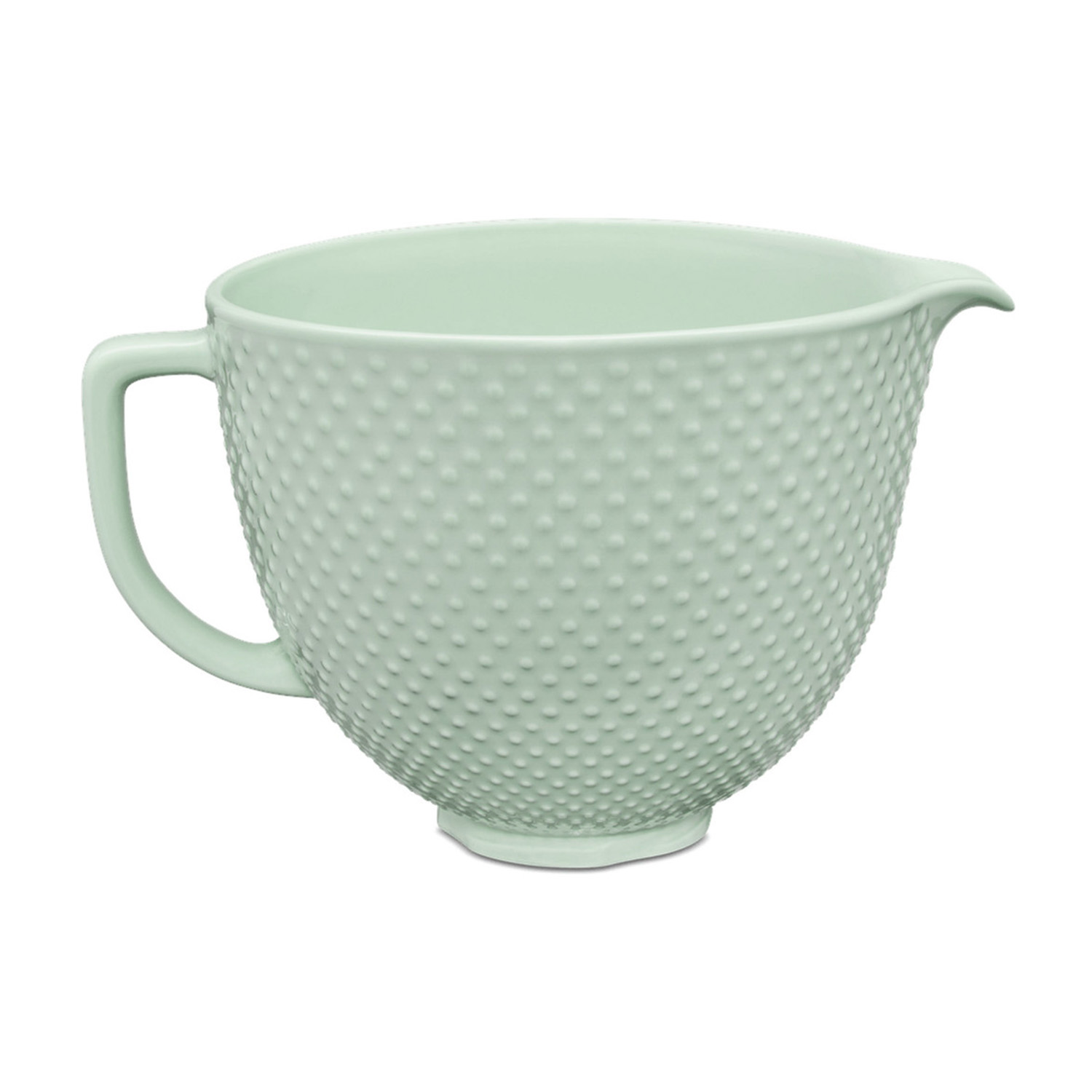 Eine hellgrüne Schüssel mit Tupfenmuster, Griff und Ausgießer.