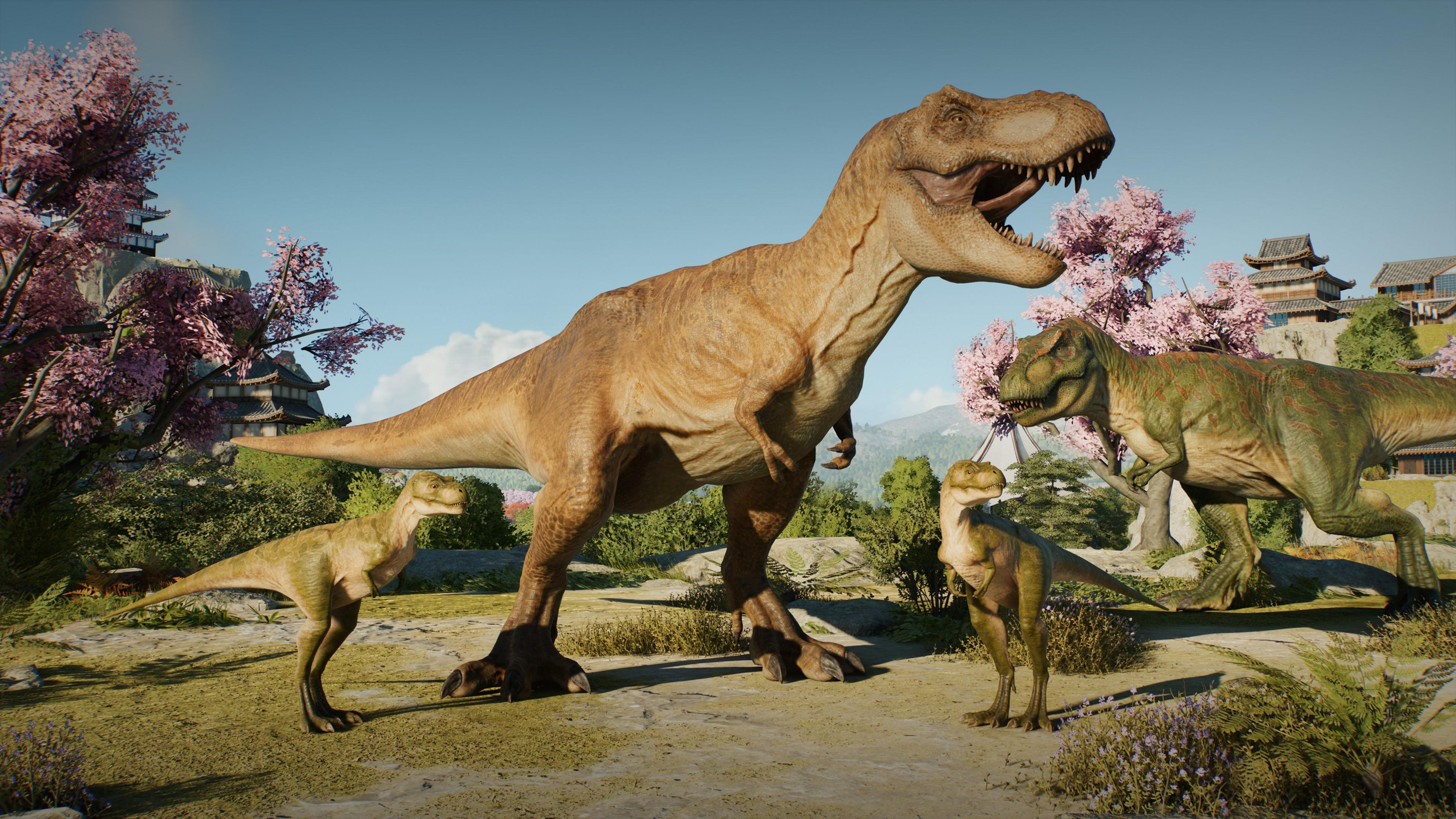 Trois dinosaures Tyrannosaures Rex se tiennent dans un paysage avec des bâtiments japonais et des cerisiers en fleurs.