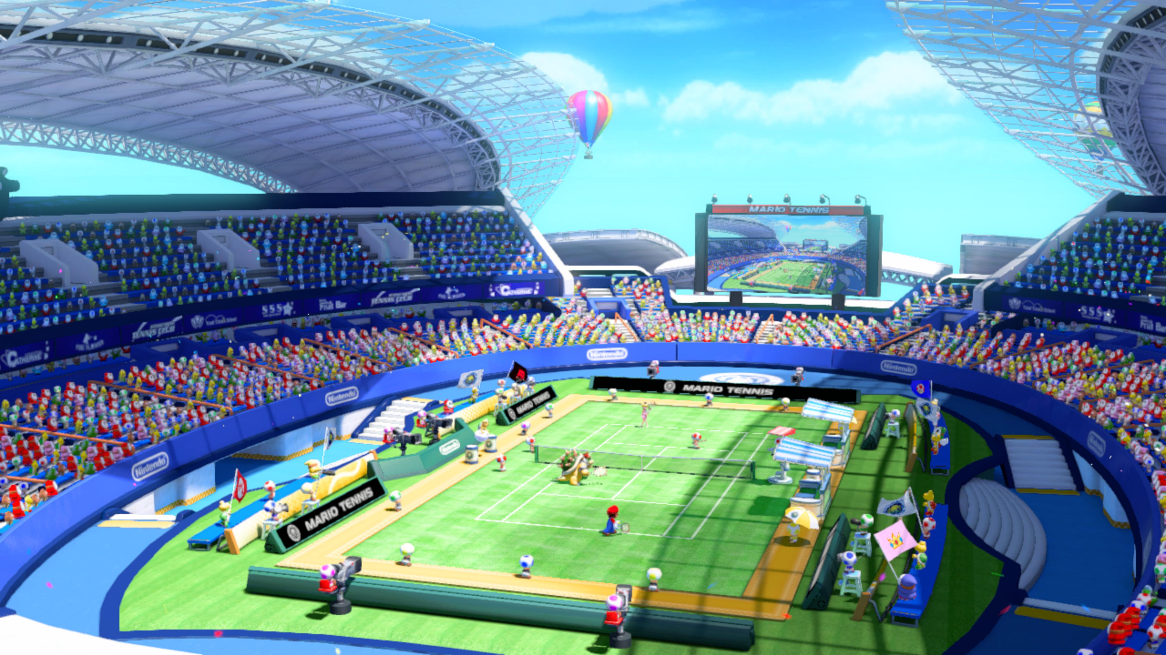 Eine Tennisarena mit Zuschauern, Spielern und einem riesigen Bildschirm.