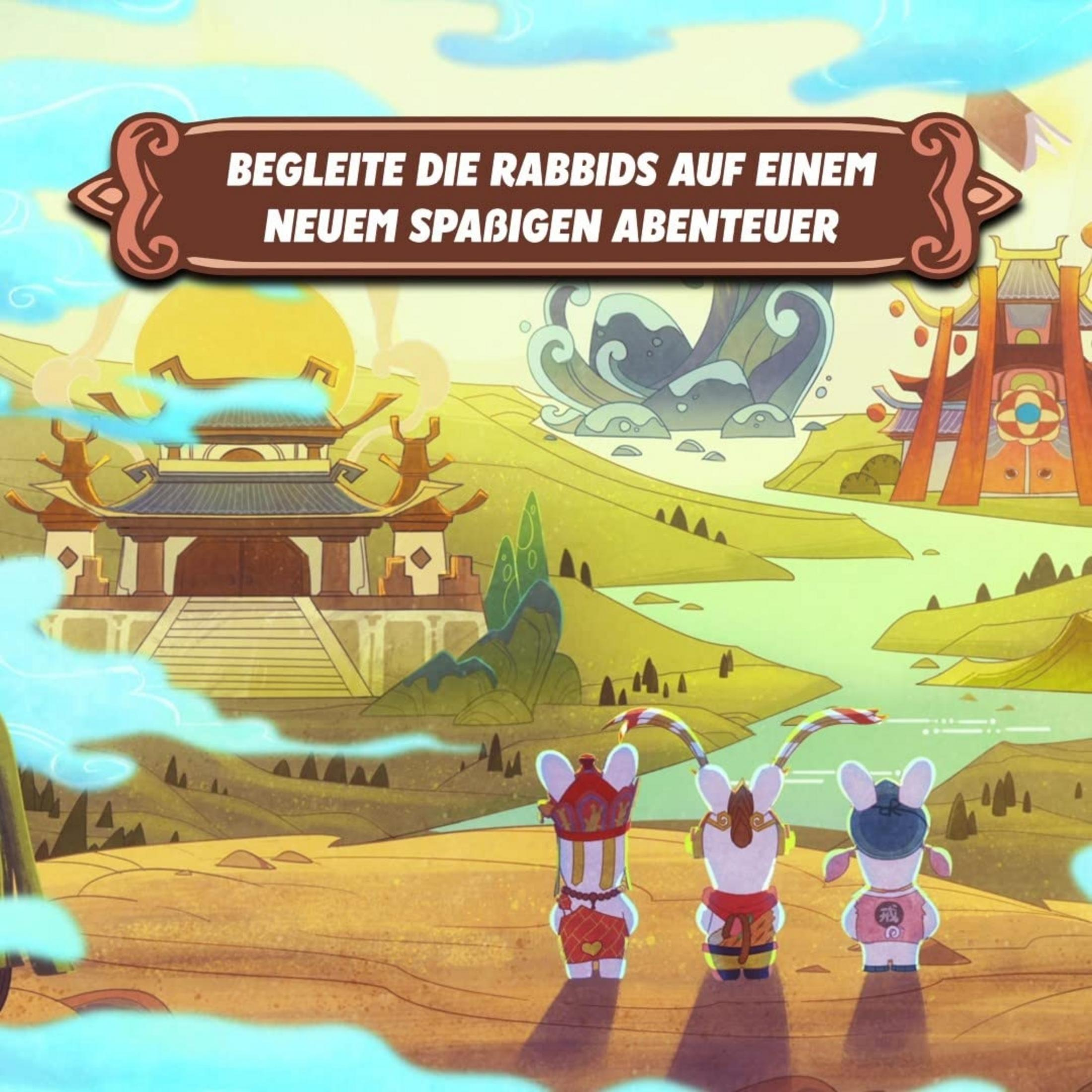 Drei Rabbids in traditioneller Kleidung stehen vor asiatischer Architektur im Morgengrauen.