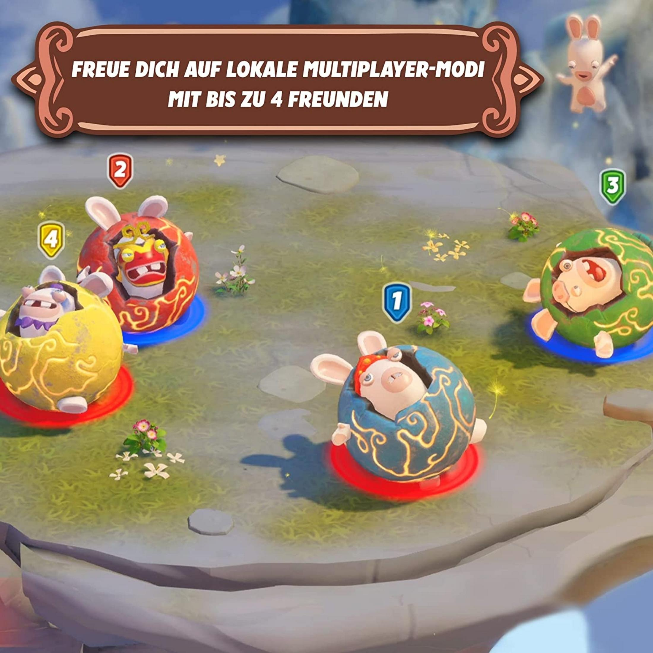 Vier Rabbids in bunten Eiern auf einer Wiese, bereit für Multiplayer-Spiele.