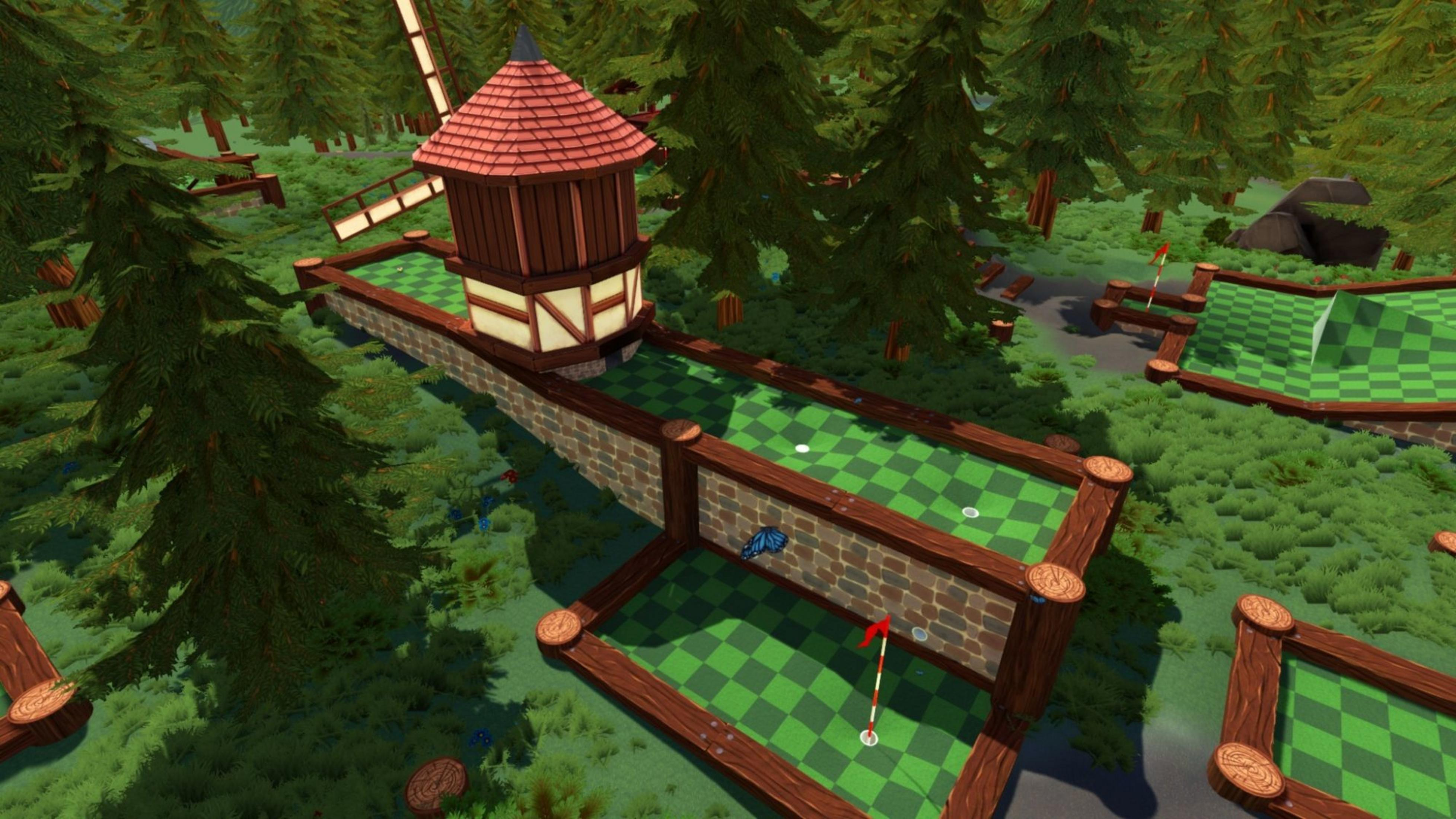 Minigolfplatz mit Windmühle, Zäunen, Bäumen und einem Schmetterling.