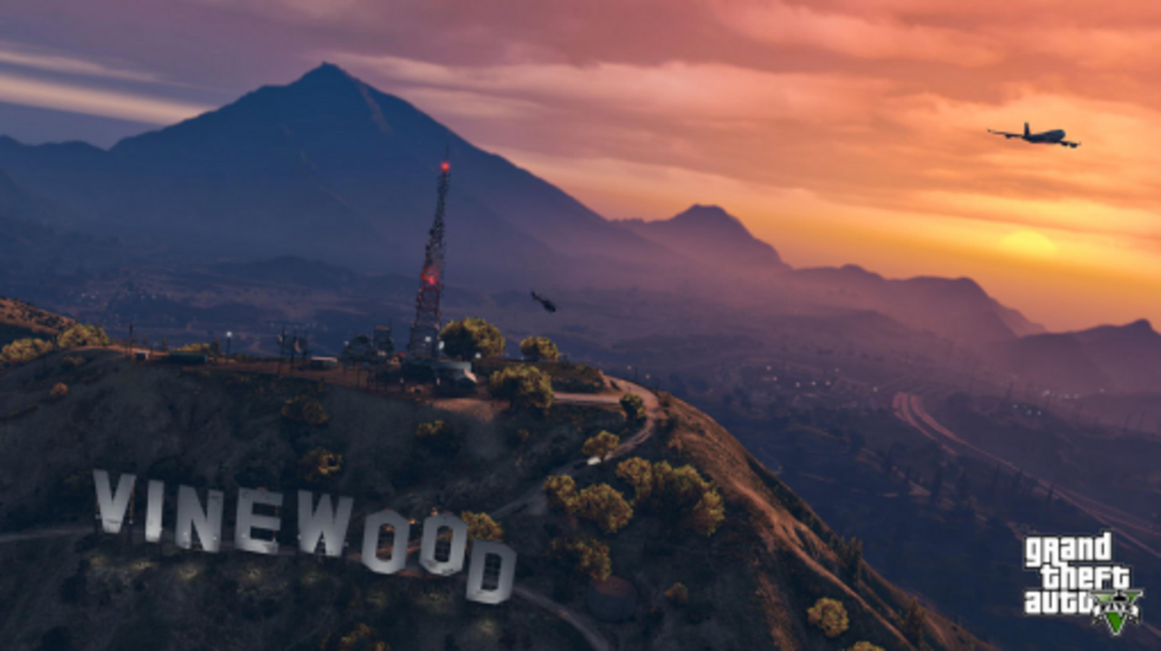 Znak Vinewood o zmierzchu z górami, samolotem i helikopterem.