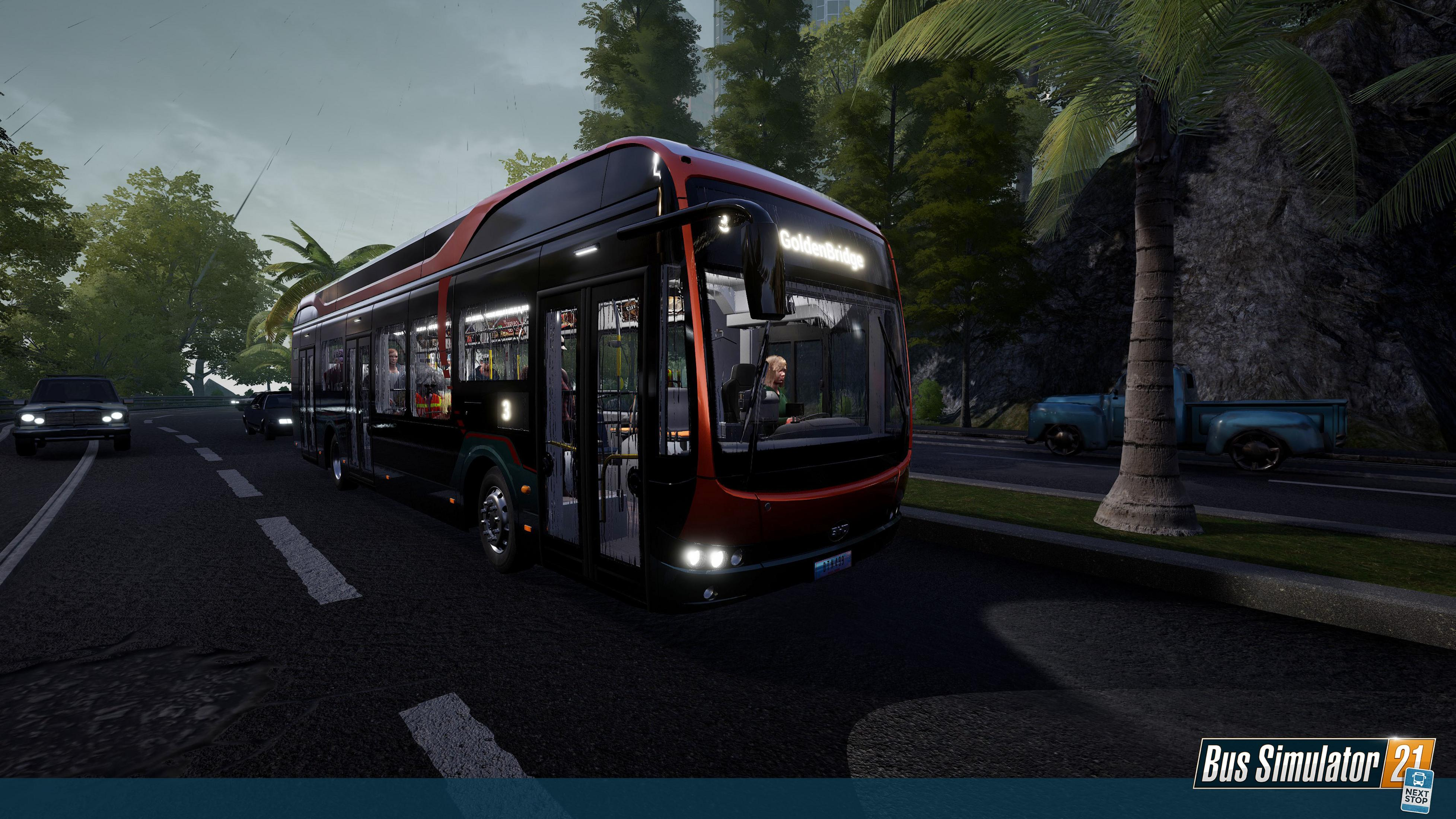 Czarny autobus z czerwonymi akcentami jedzie drogą w deszczu. Palmy i drzewa w tle.