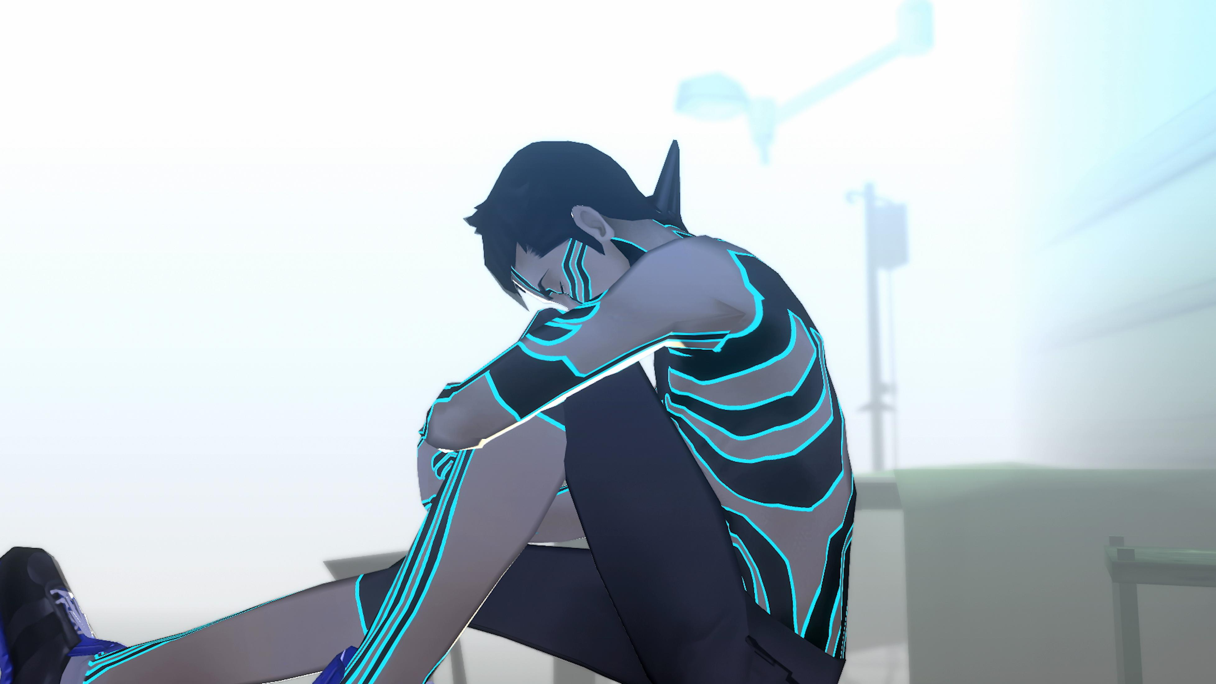 Postać z niebieskimi liniami siedzi na podłodze, głowa na kolanach.