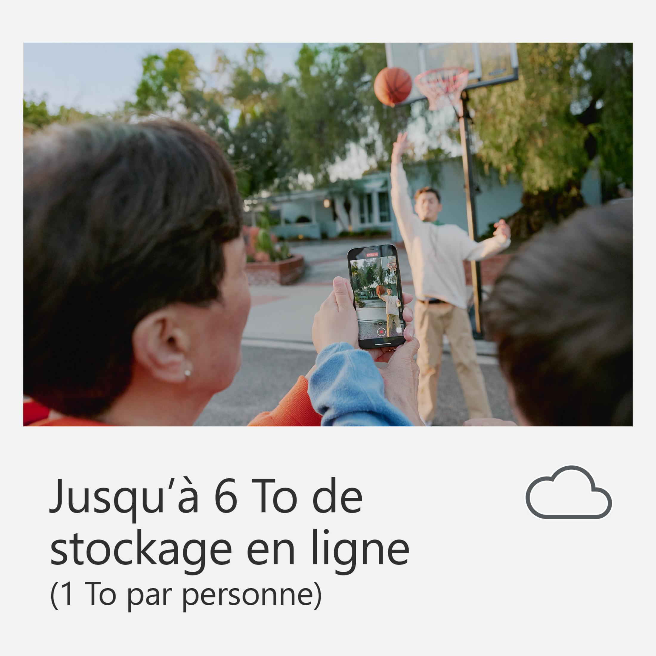 Persone che filmano qualcuno giocare a basket con un telefono.