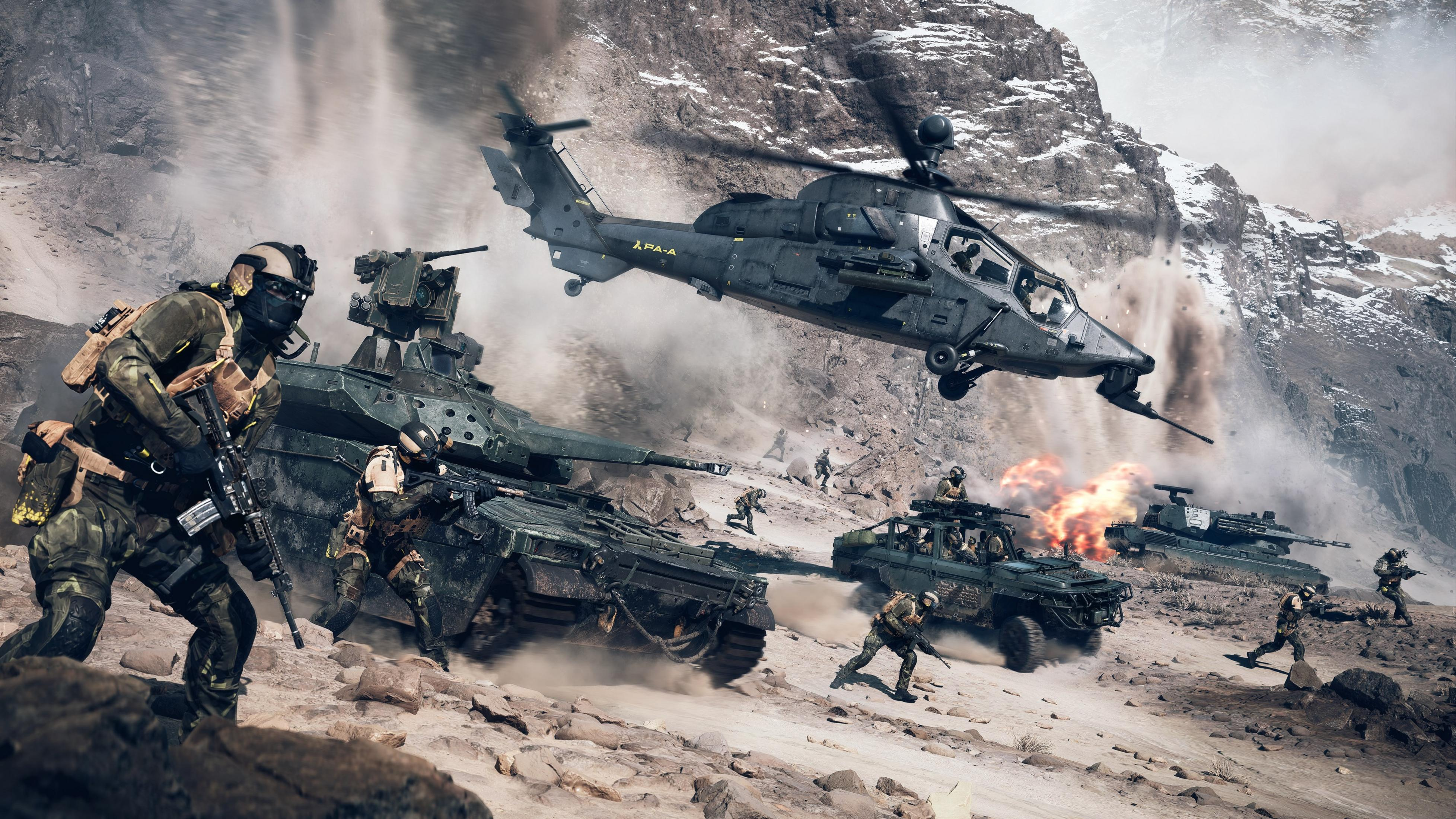 Militair gevecht in rotsachtig landschap met tanks, helikopter en soldaten.
