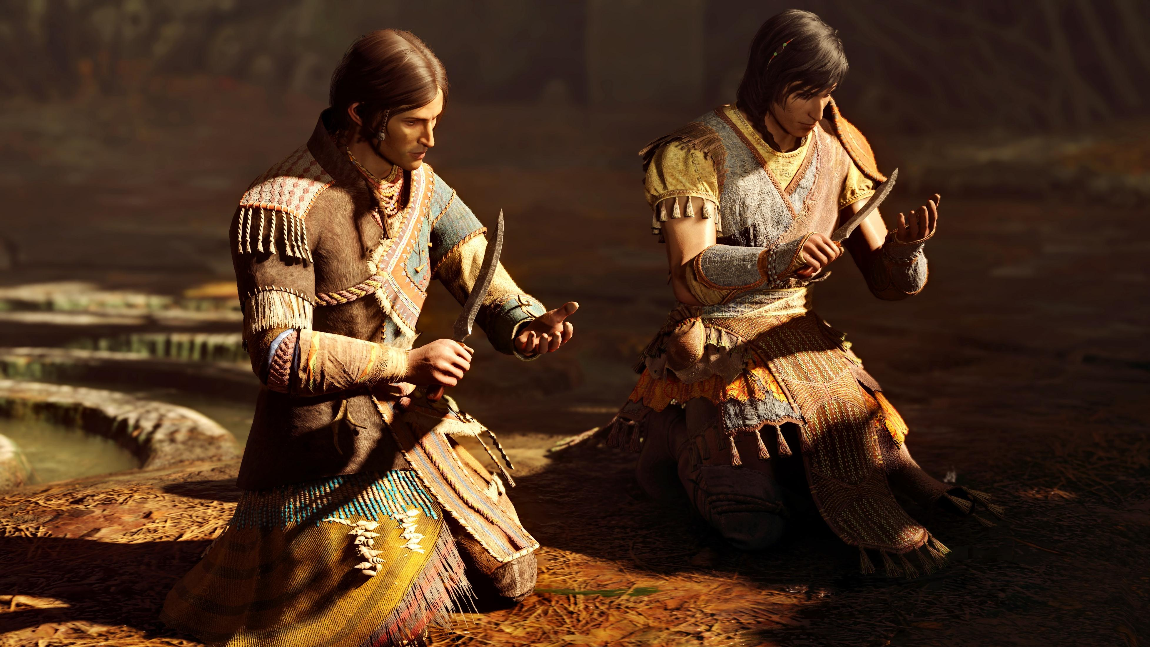 Deux hommes en tenue traditionnelle s'agenouillent, tenant des couteaux.