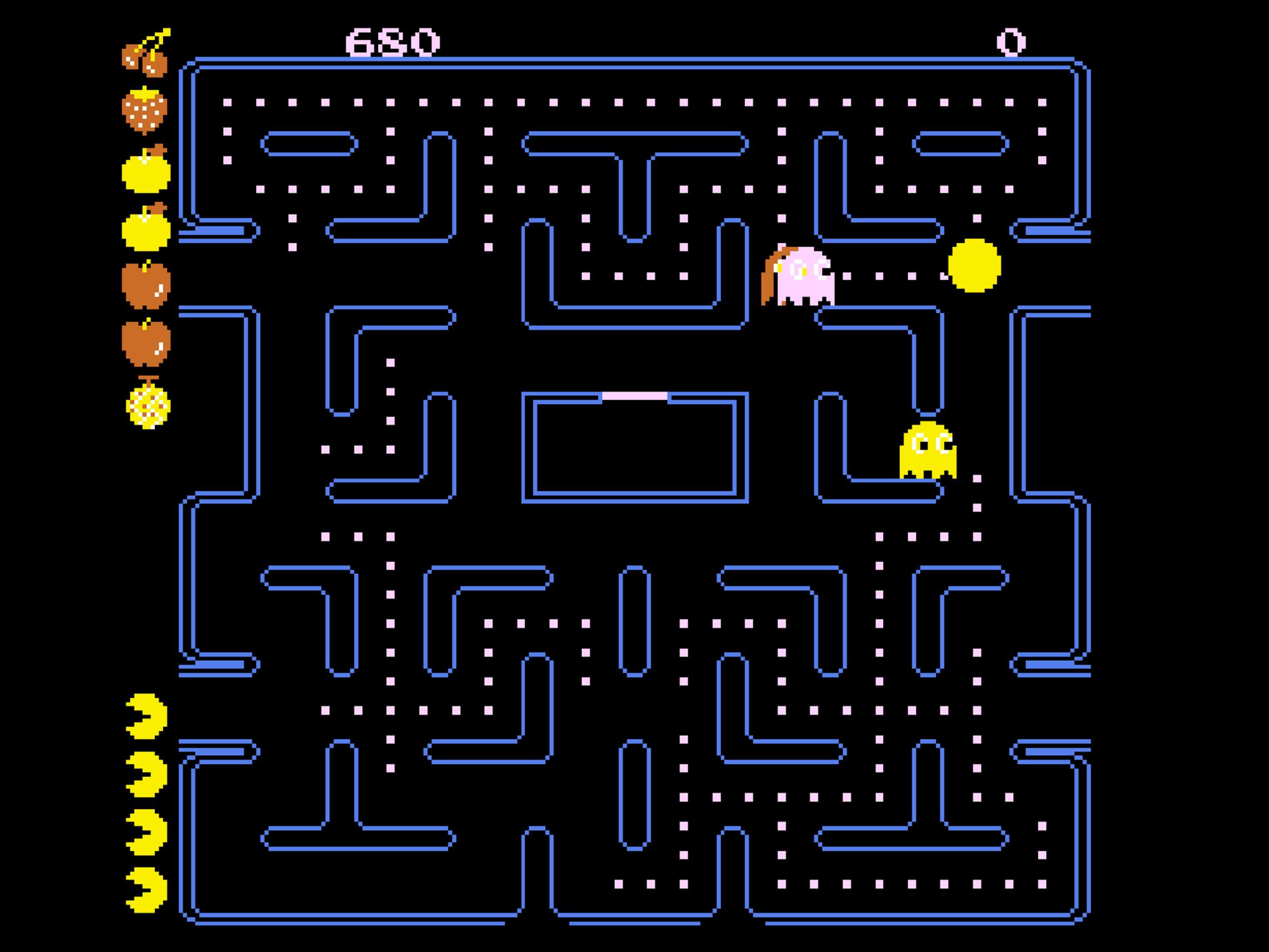 Pac-Man naviga in un labirinto, mangiando punti ed evitando un fantasma.