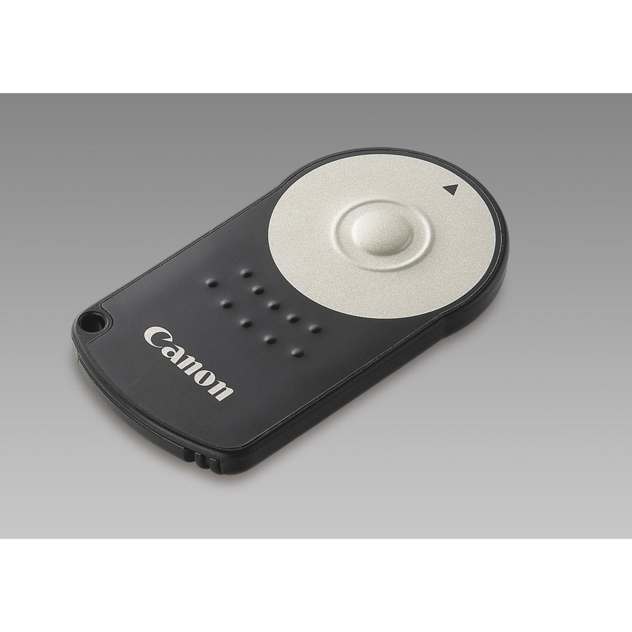 Ein schwarzer Canon Fernauslöser mit einem silbernen runden Knopf und Punkten.