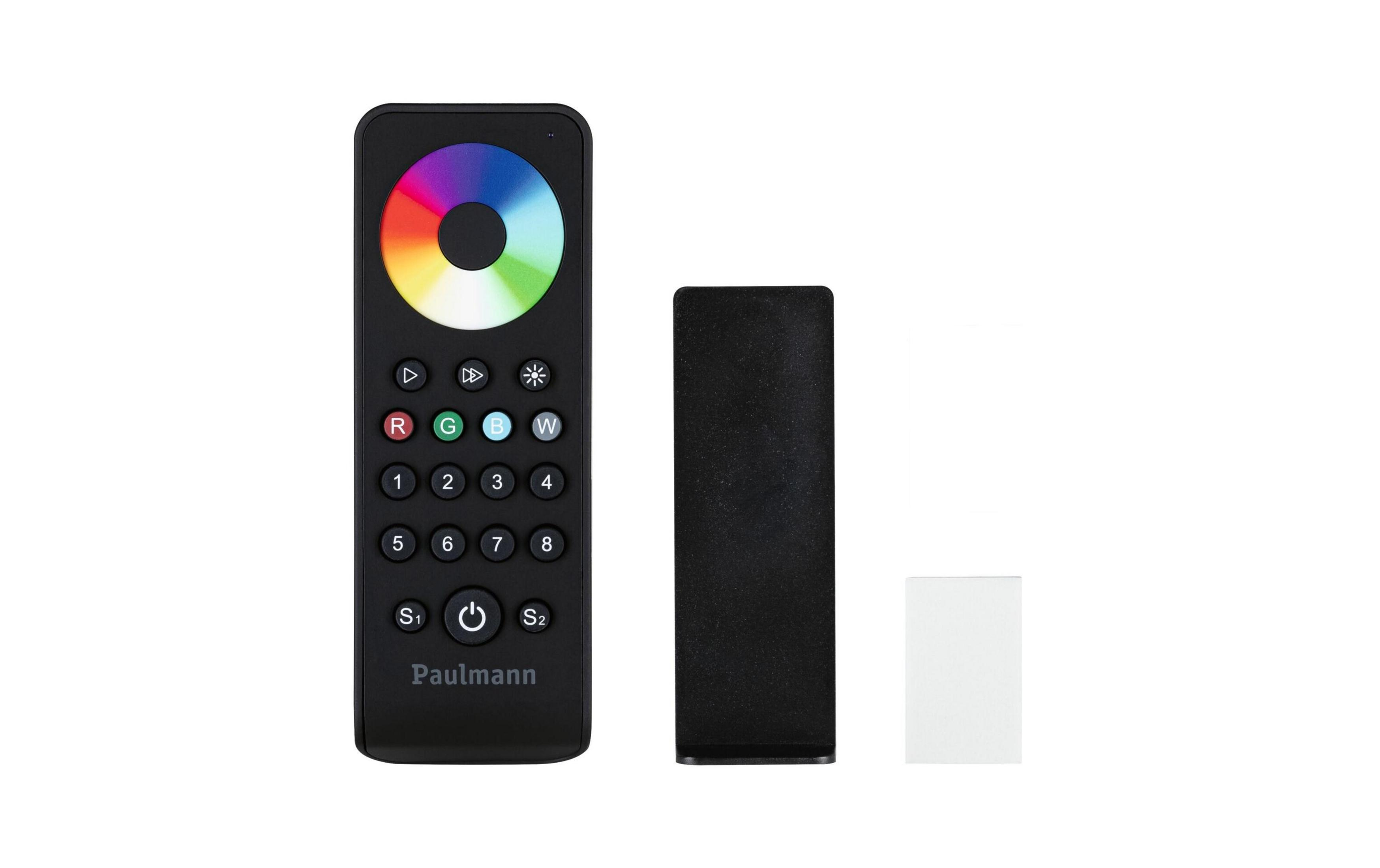 Czarny pilot z kołem kolorów i przyciskami, obok czarnego i białego bloku.