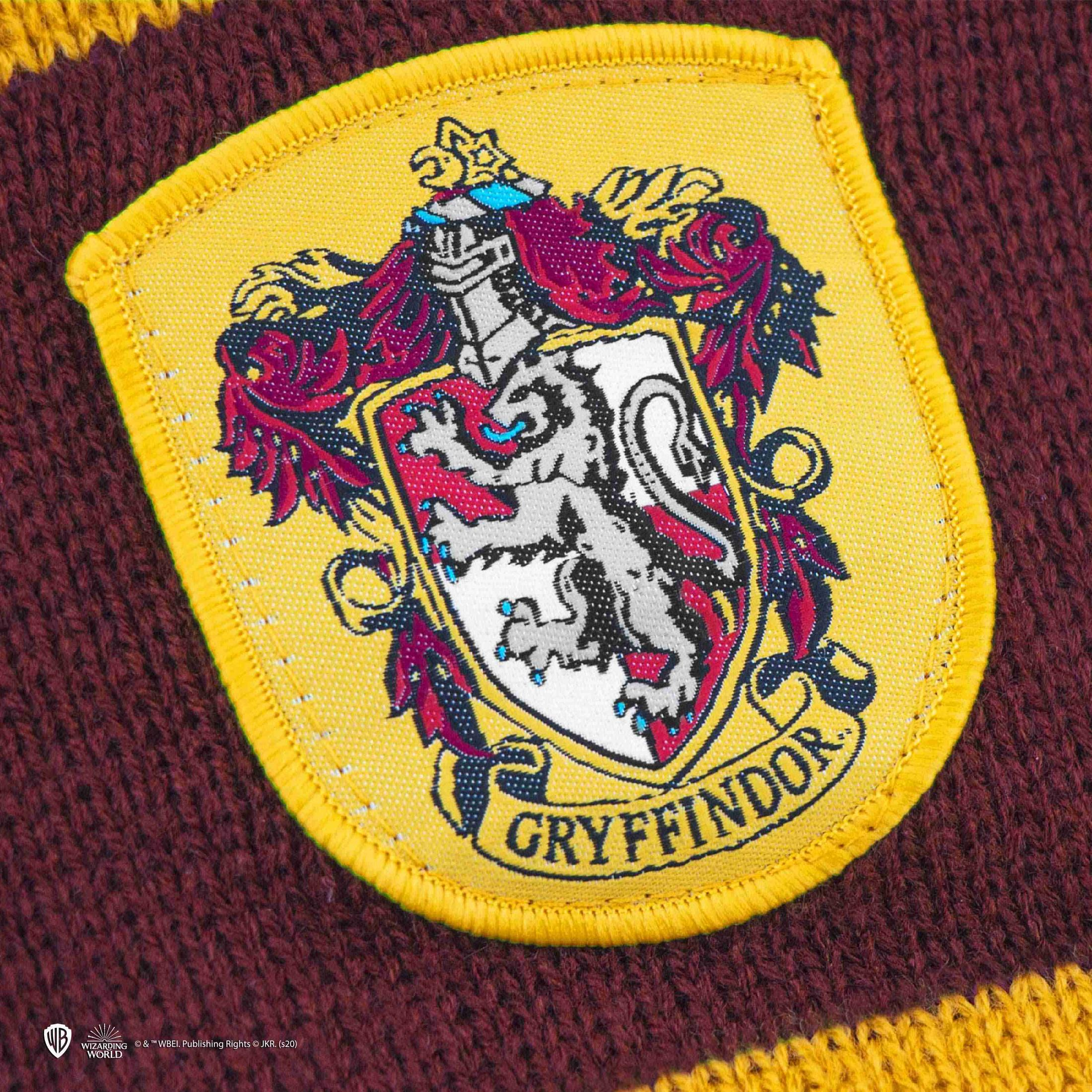 Gryffindor-Wappen auf einem gestrickten Stoff in Rot und Gelb.