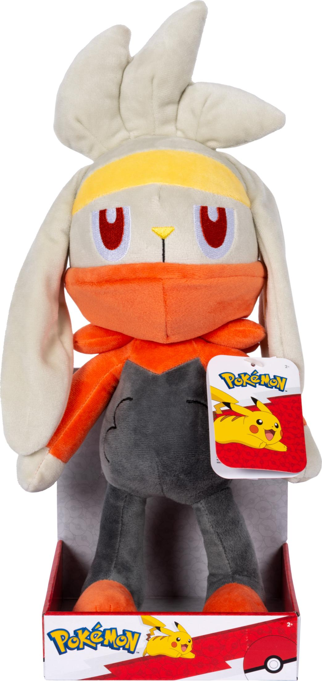 Ein Pokémon-Plüschtier mit gelbem Band, orangefarbener Maske und grauen Beinen.