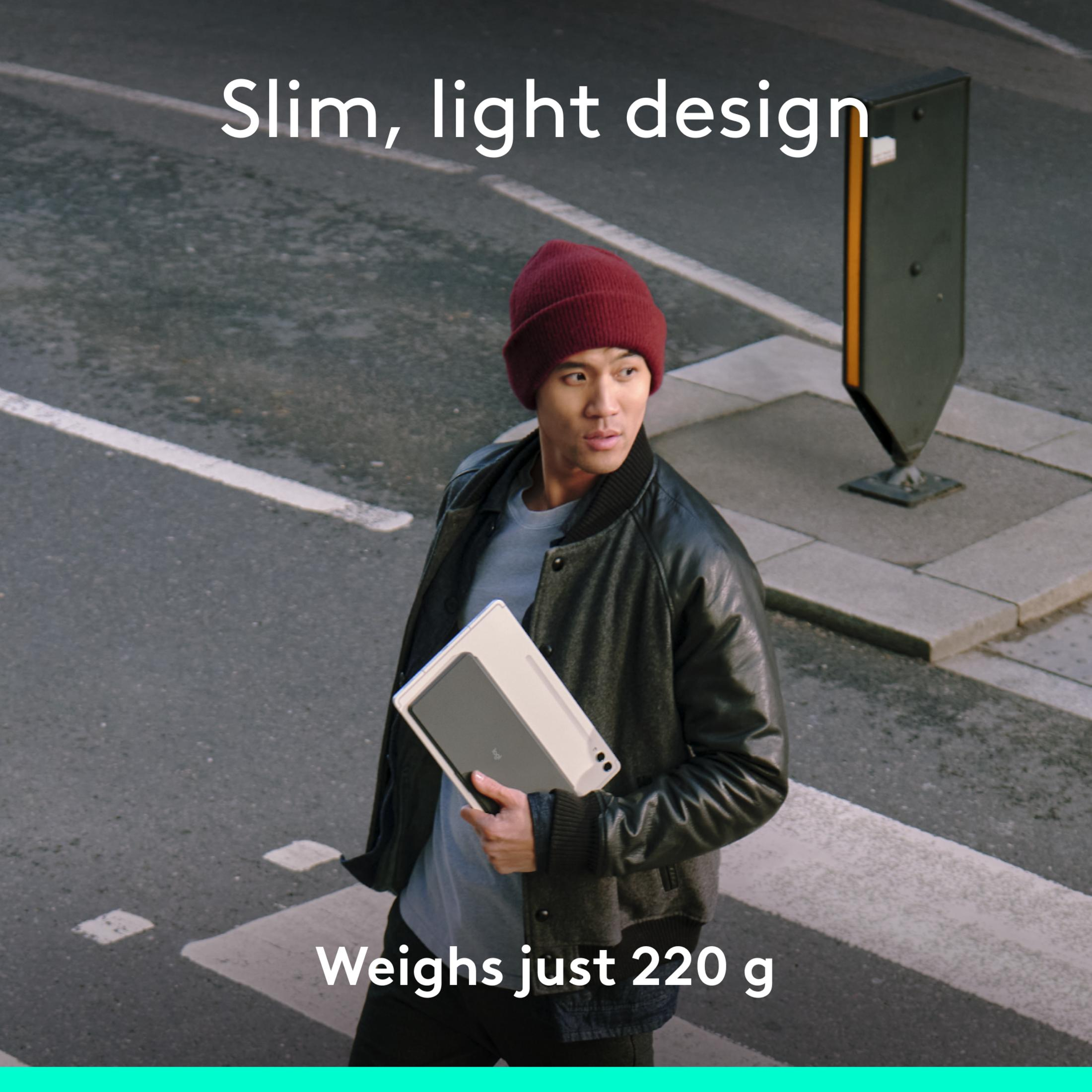 Uomo con tablet sulle strisce pedonali; Design sottile e leggero. Pesa solo 220 g.