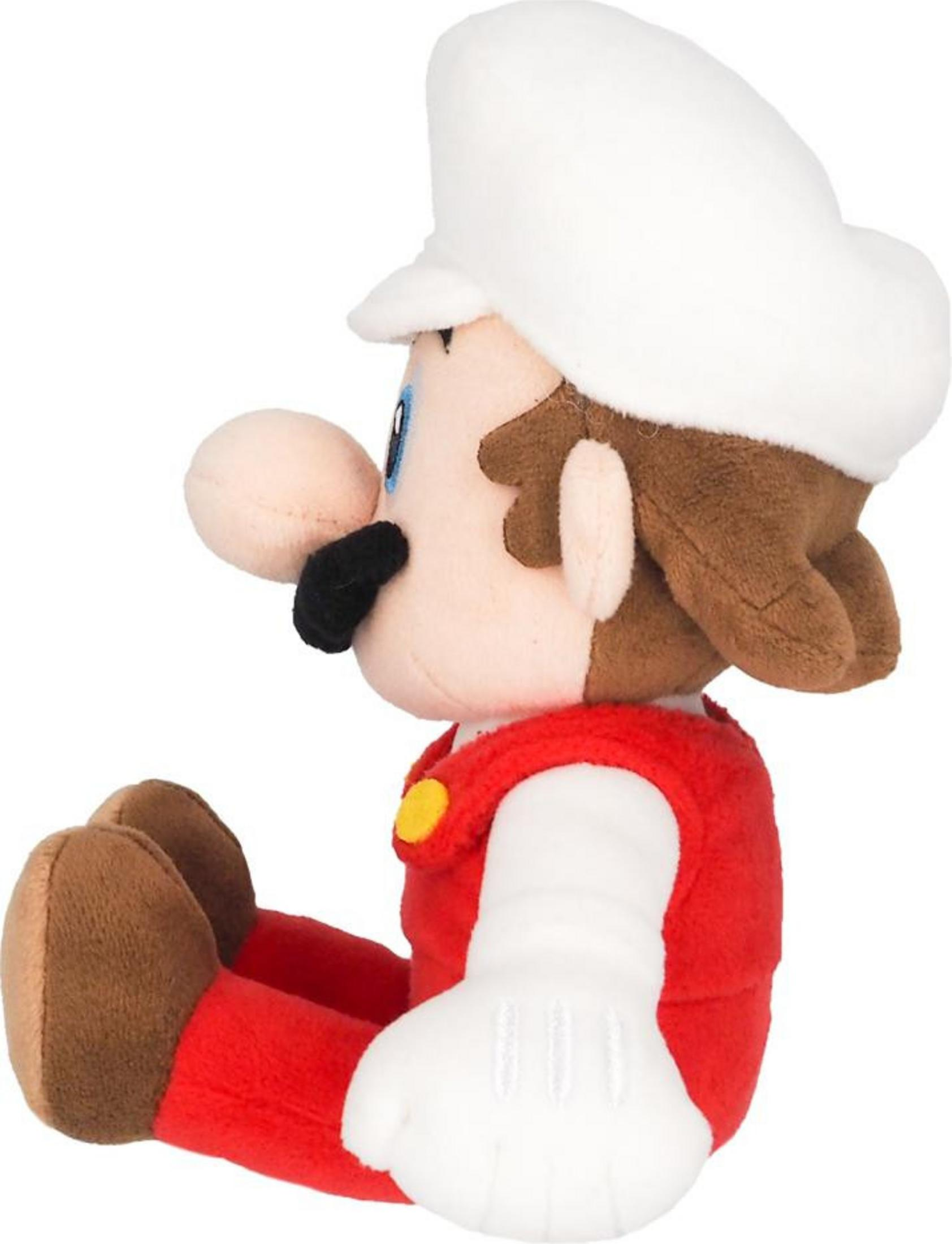 Stoff-Mario in roter Latzhose, weißen Handschuhen und weißem Hut sitzt mit braunen Schuhen.