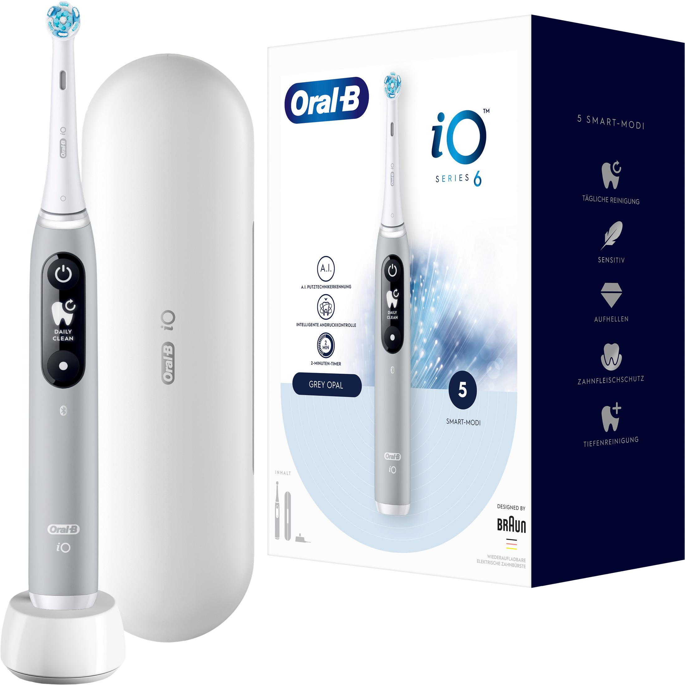 Szara szczoteczka elektryczna Oral-B iO Series 6 ze stacją ładującą i opakowaniem.
