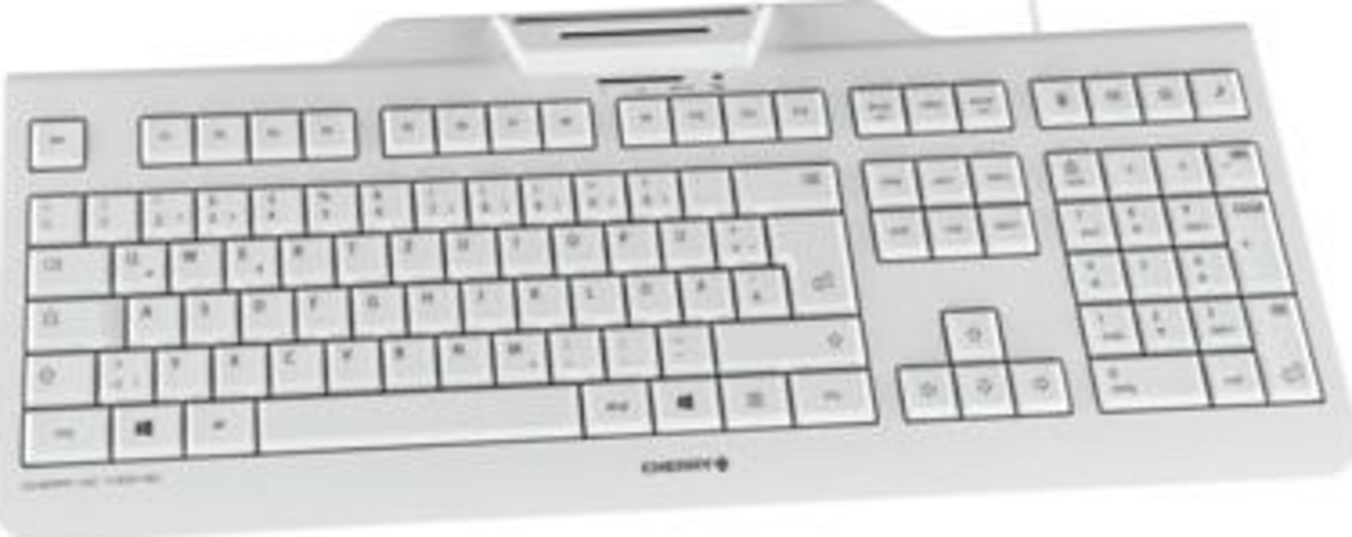 Una tastiera bianca per computer con molti tasti, appoggiata su una scrivania.