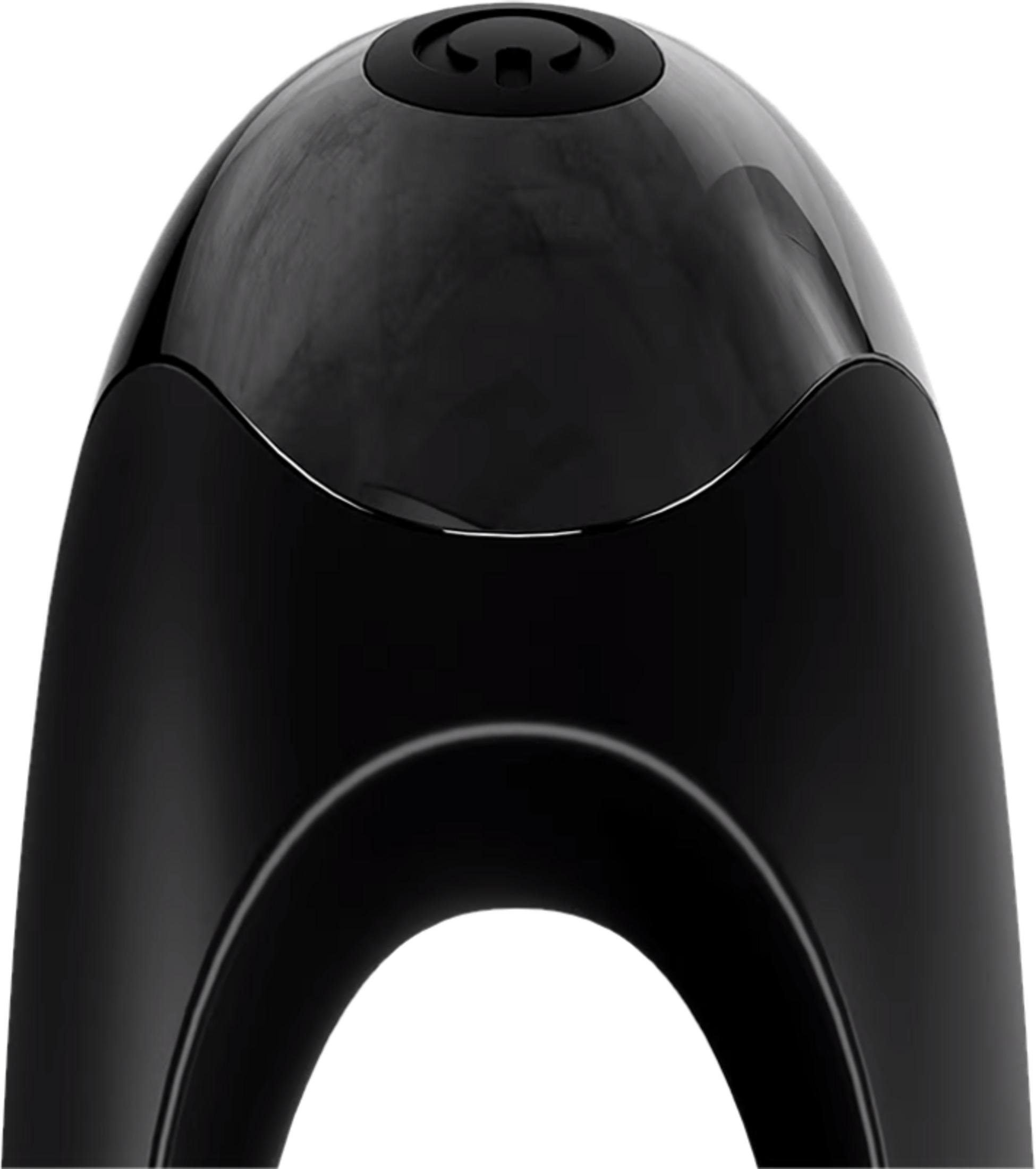 Czarny, błyszczący przedmiot z zakrzywionymi liniami i przyciskiem na górze.