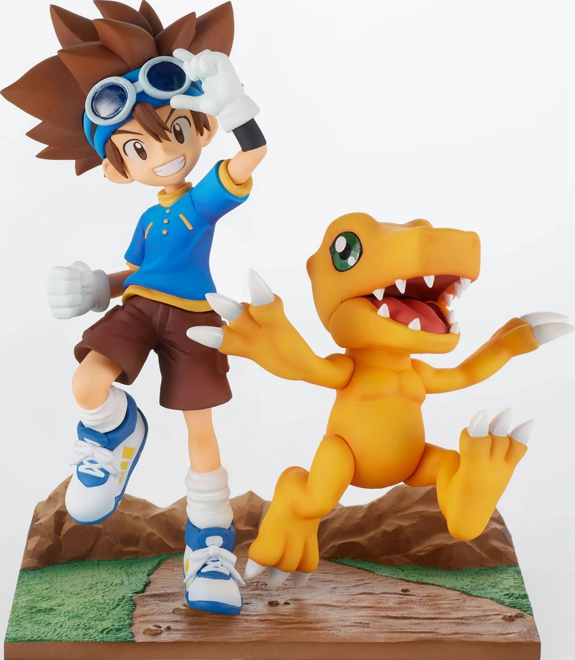 Figurine d'un garçon en bleu avec lunettes à côté d'un dinosaure orange.