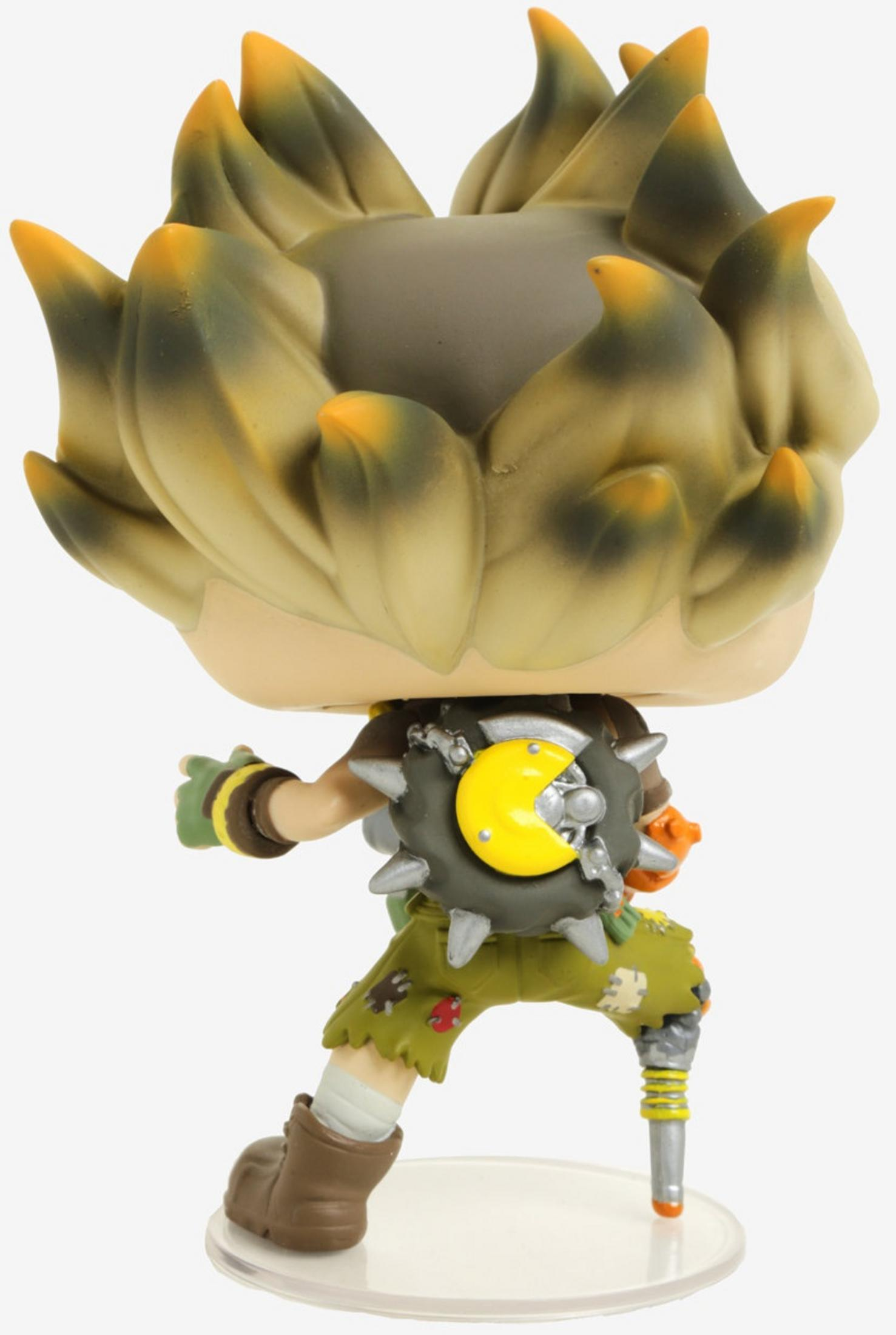 Eine Figur mit stacheliger Frisur, grüner Kleidung und einem gelben Pac-Man-Emblem.