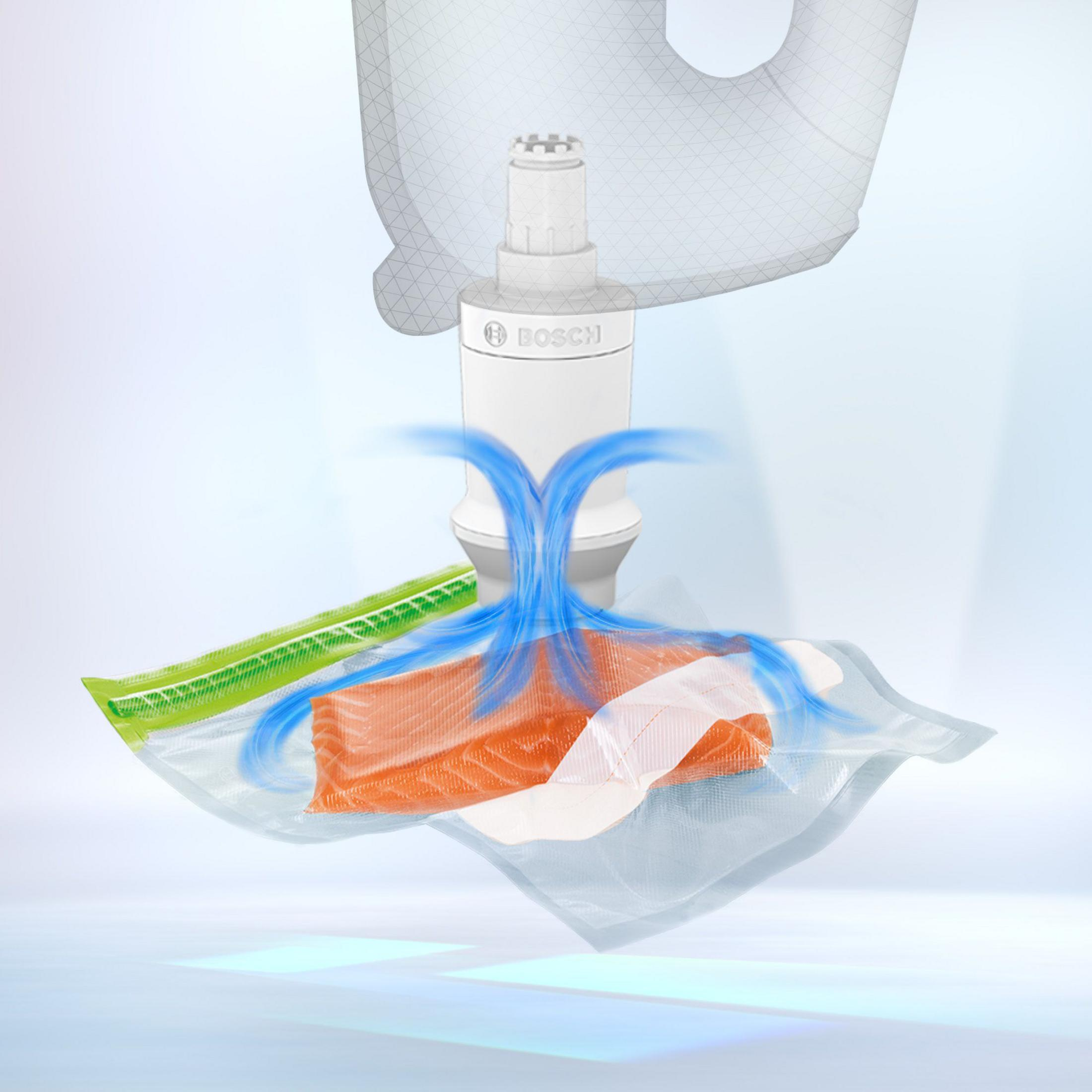 A Bosch vacuum sealer sucks air from a bag containing salmon and green beans.