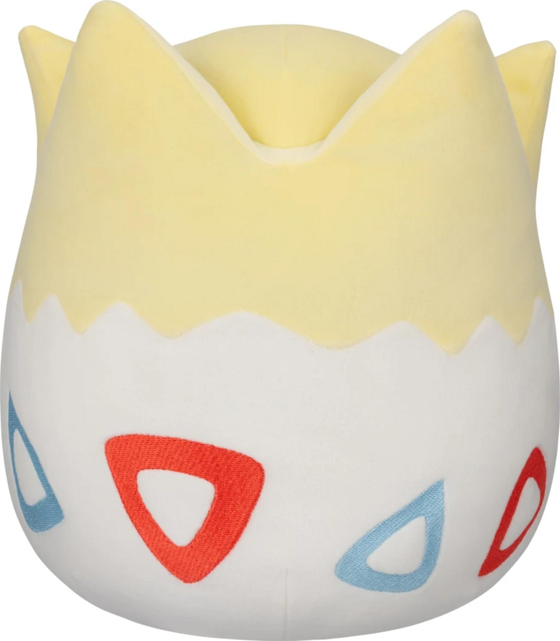 Un peluche giallo di Togepi con triangoli bianchi e rossi su sfondo bianco.
