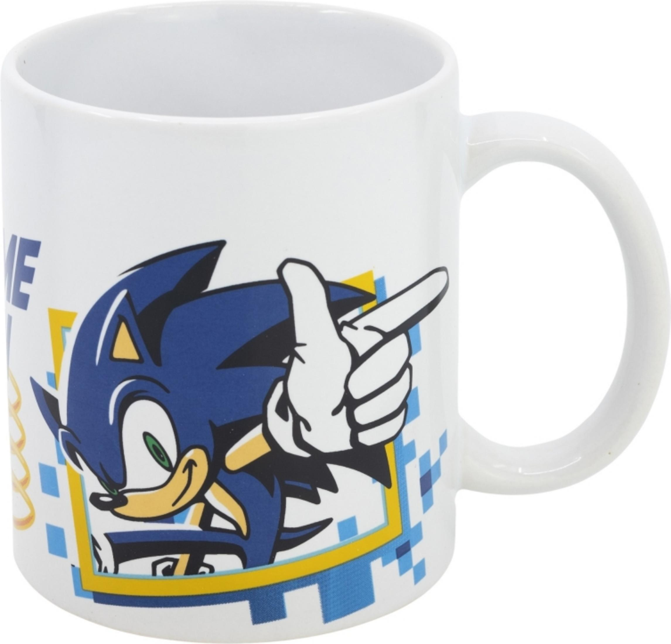 Taza blanca con Sonic el Erizo señalando píxeles azules y amarillos.