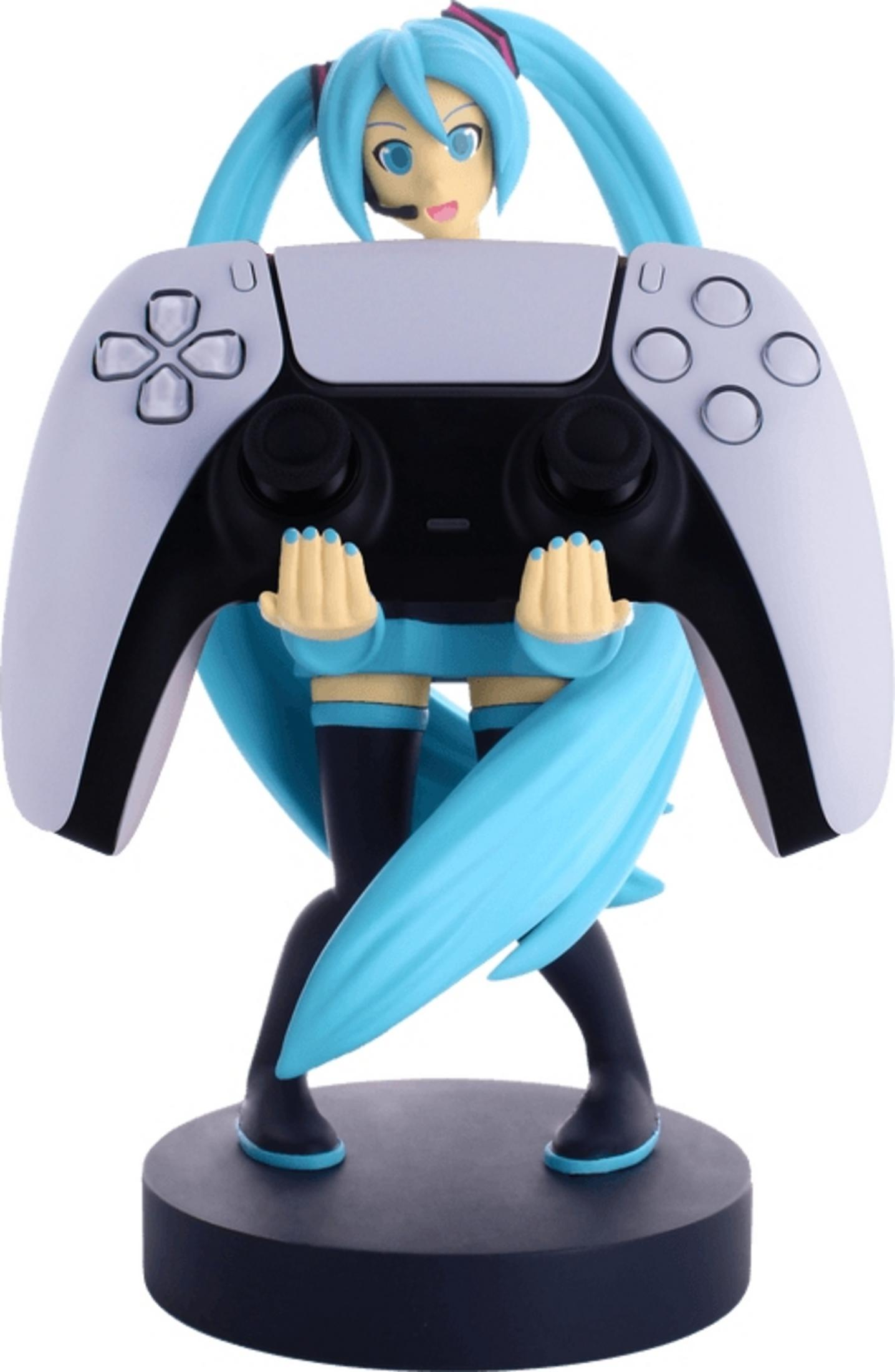 Una figura con capelli blu tiene un controller bianco su base nera.